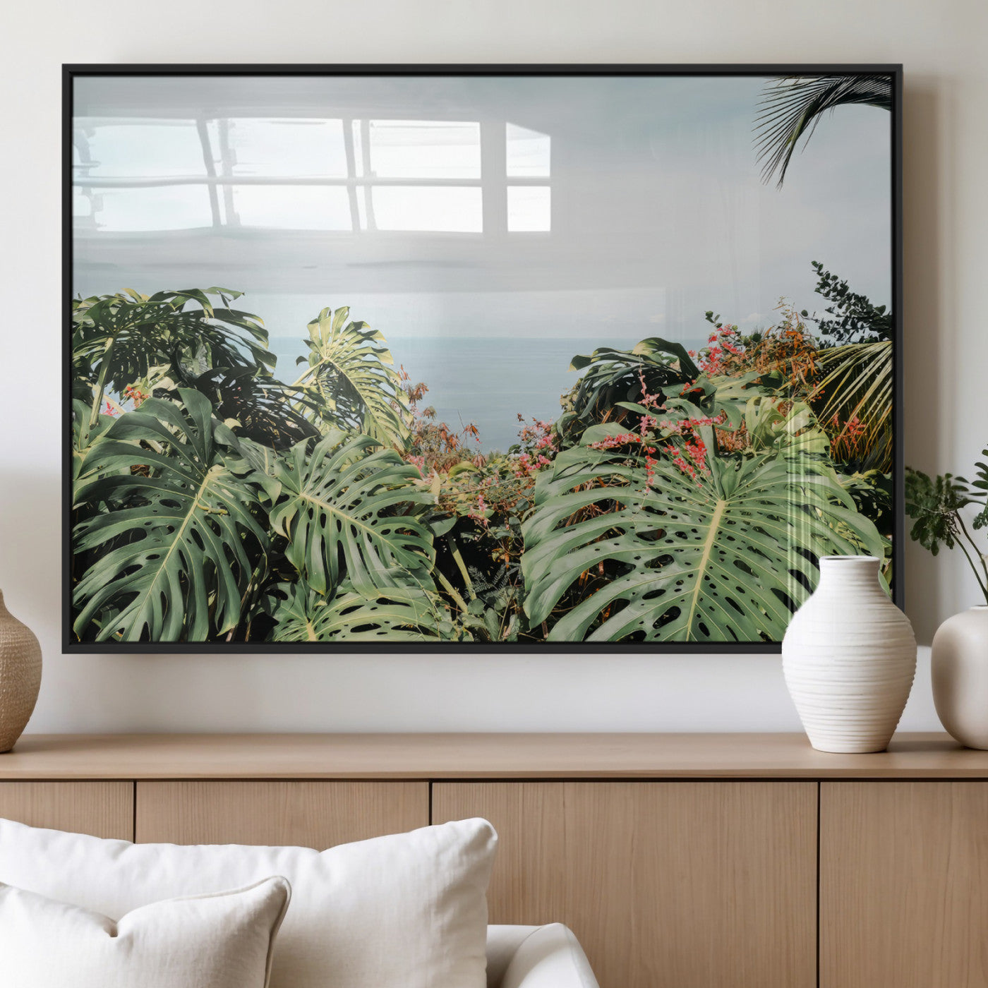 Monstera leaves and tropical flowers framing a calm ocean view, ideal for tropical coastal or exotic jungle-style interior wall decor.