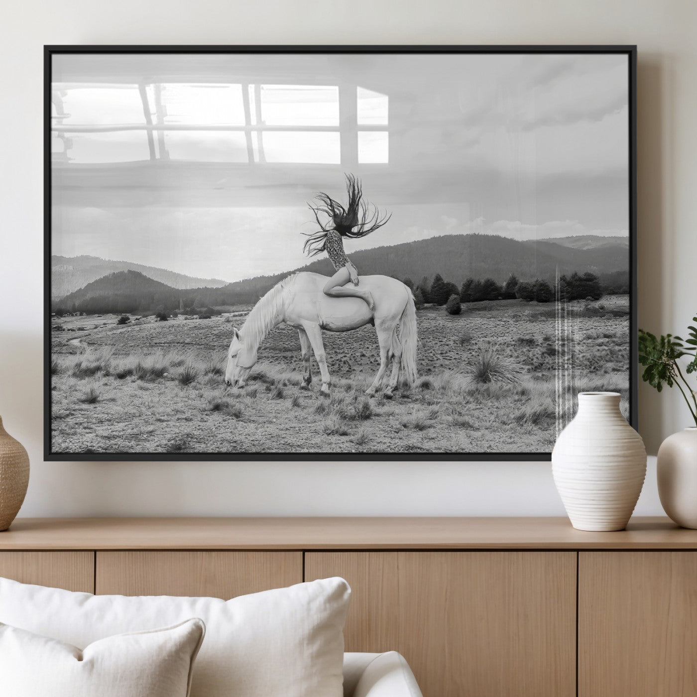 Black and white photo of a woman on a white horse in moody tones, ideal for Western Boho or modern rustic-style home decor.