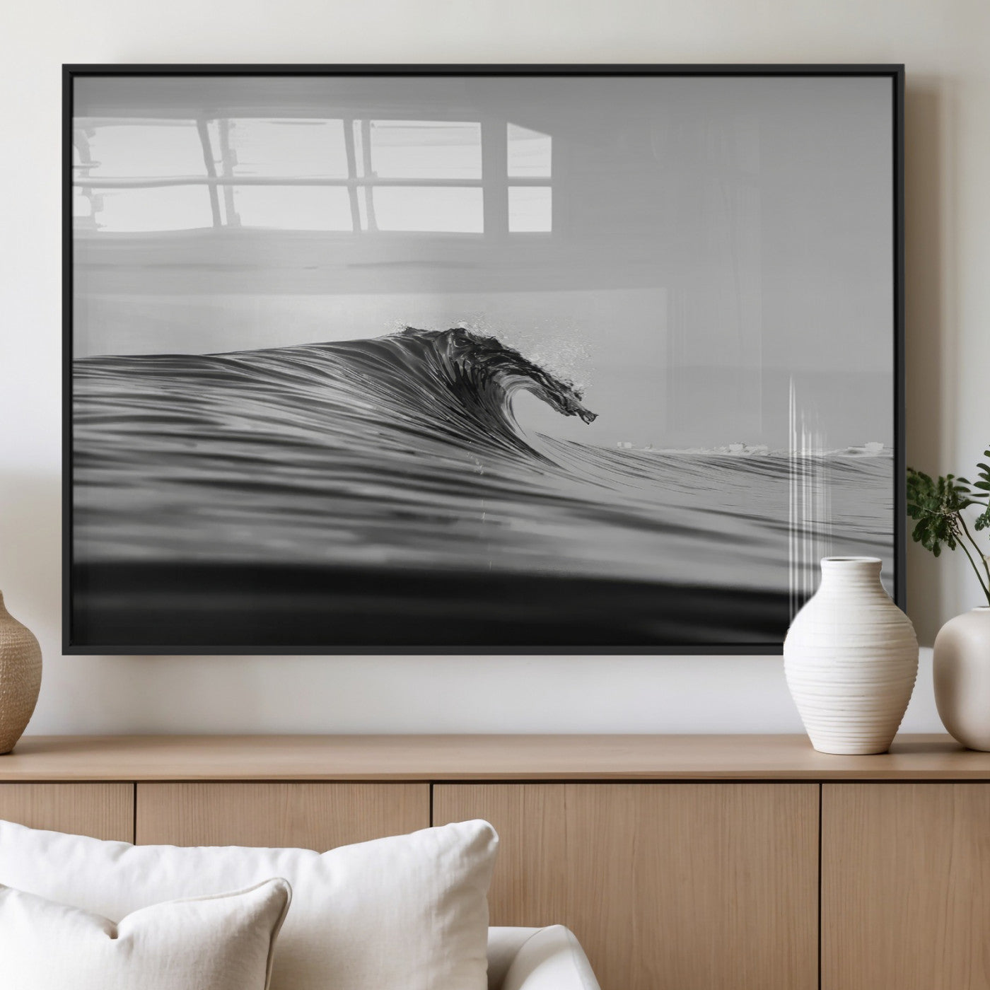 Striking black and white photo of a curling wave, ideal for modern coastal or minimalist wall decor settings.