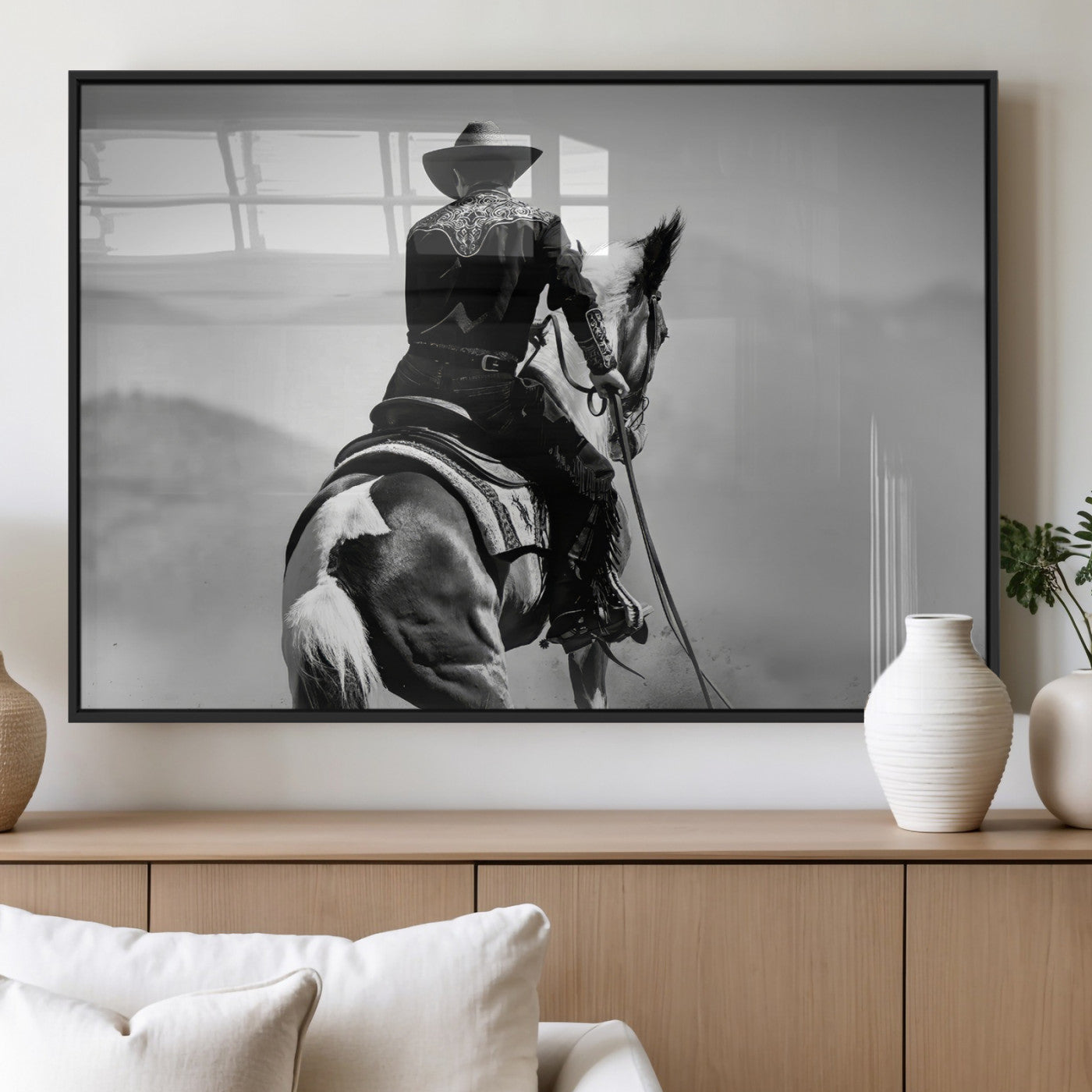 Black and white canvas of a cowboy on horseback with moody tones, perfect for rustic western or country-inspired home decor.