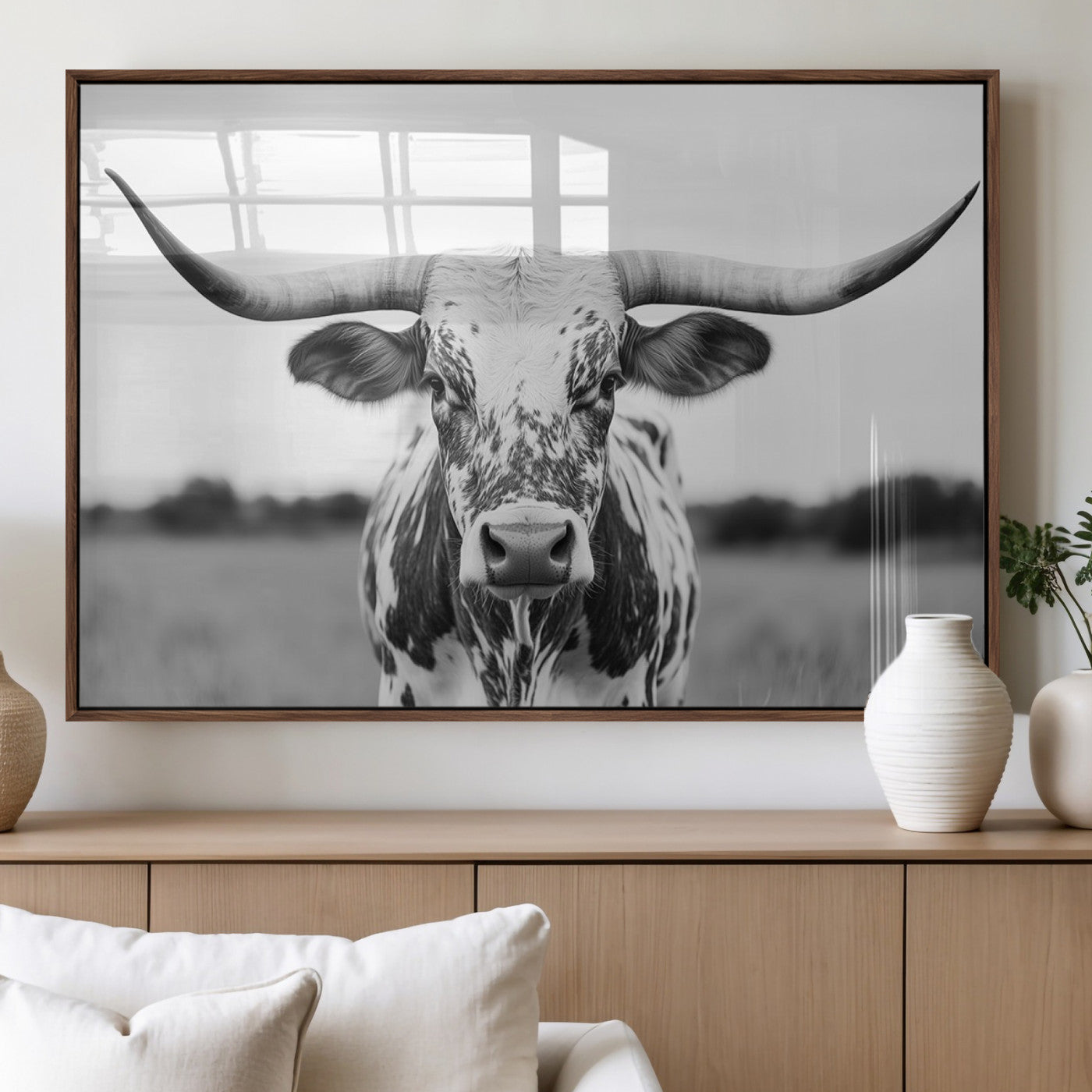 Capture the strength and elegance of nature with this striking black and white portrait of a longhorn cow. Its powerful presence makes a bold statement in any room.