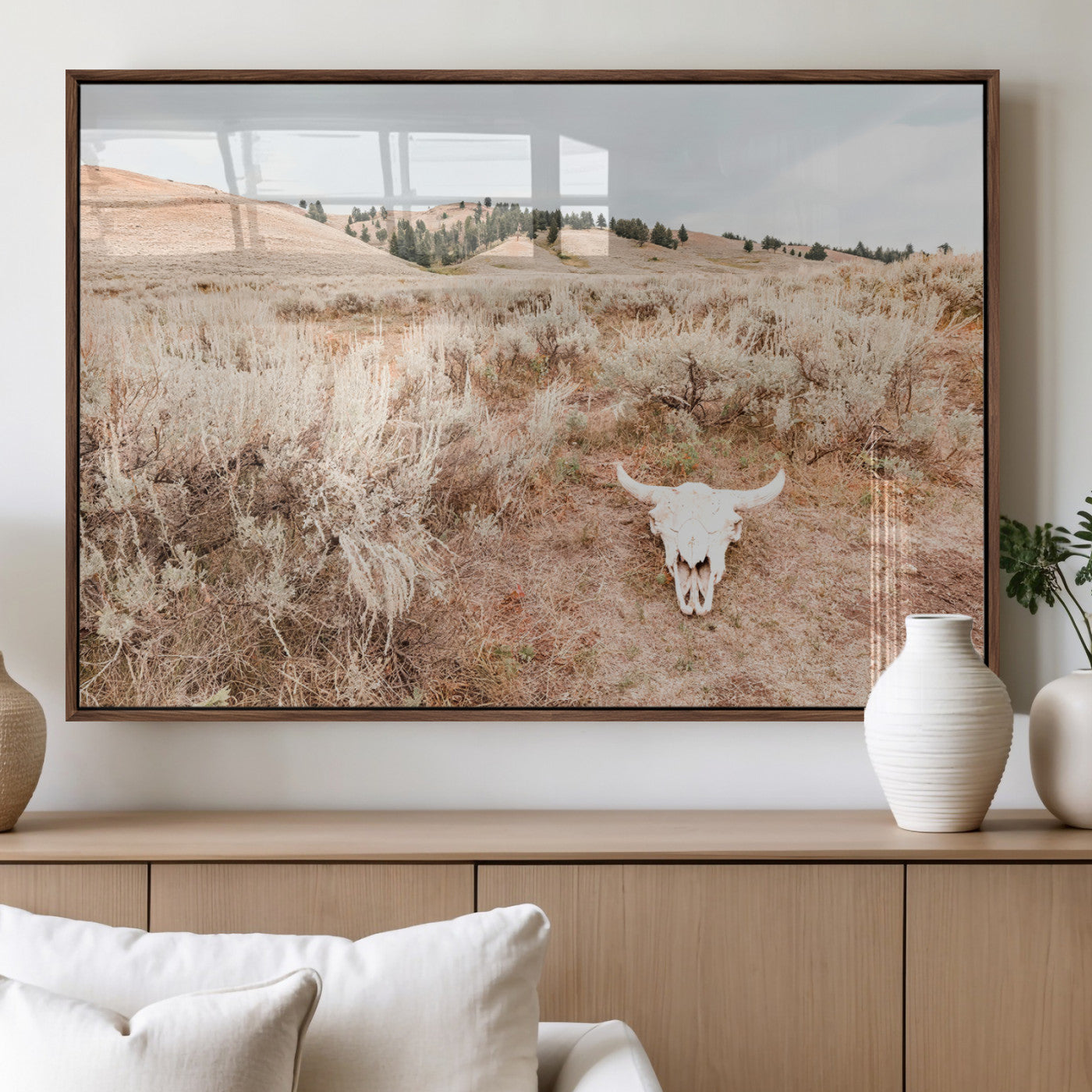 Rustic bull skull on dry sagebrush field under soft light, ideal for western minimal or desert prairie-style wall decoration.