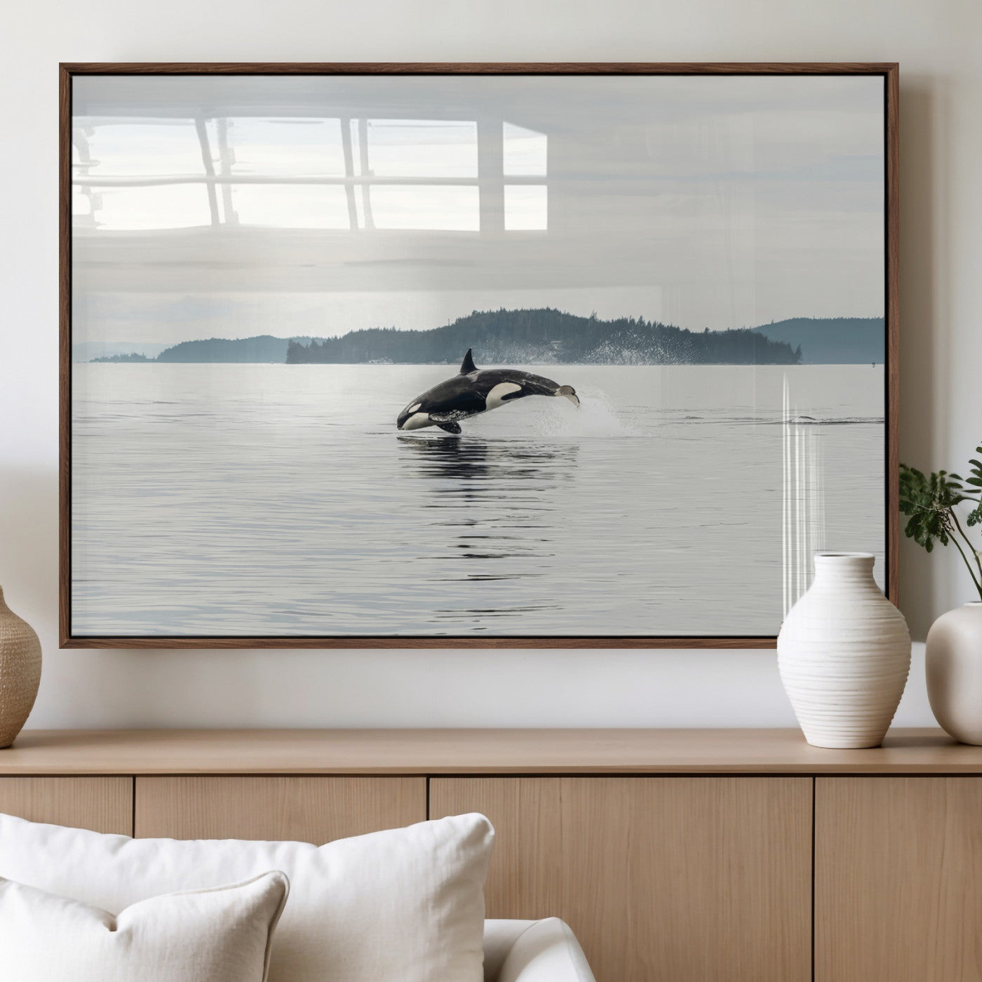 An orca jumping out of calm ocean waters with a misty island in the background, creating a serene and minimalist marine wildlife scene.