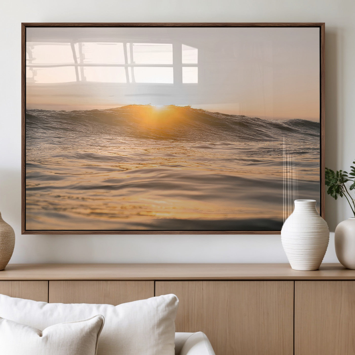 Ocean waves glowing under a warm golden sunset, reflecting soft light and calm movement, perfect for warm minimalist coastal interiors.