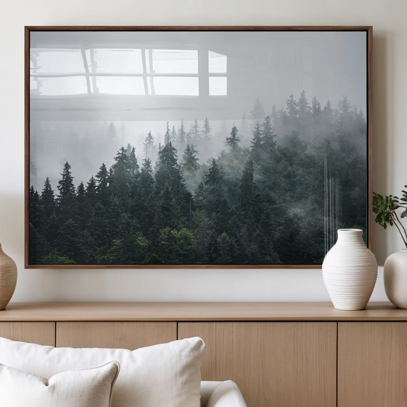 A misty evergreen forest shrouded in soft fog, creating a tranquil and moody landscape with lush green trees fading into the distance.