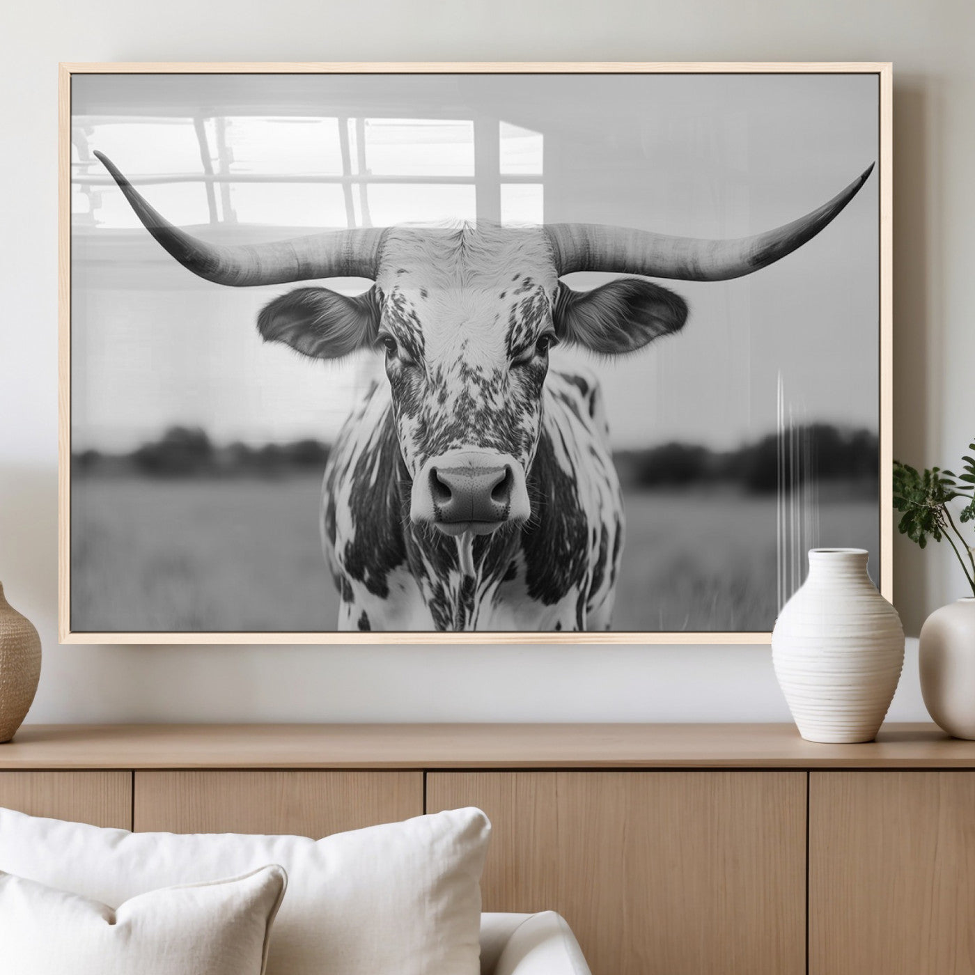 Capture the strength and elegance of nature with this striking black and white portrait of a longhorn cow. Its powerful presence makes a bold statement in any room.
