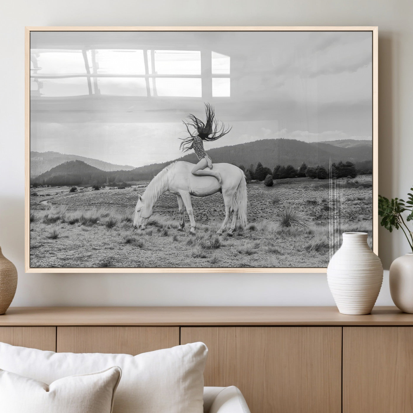 Black and white photo of a woman on a white horse in moody tones, ideal for Western Boho or modern rustic-style home decor.