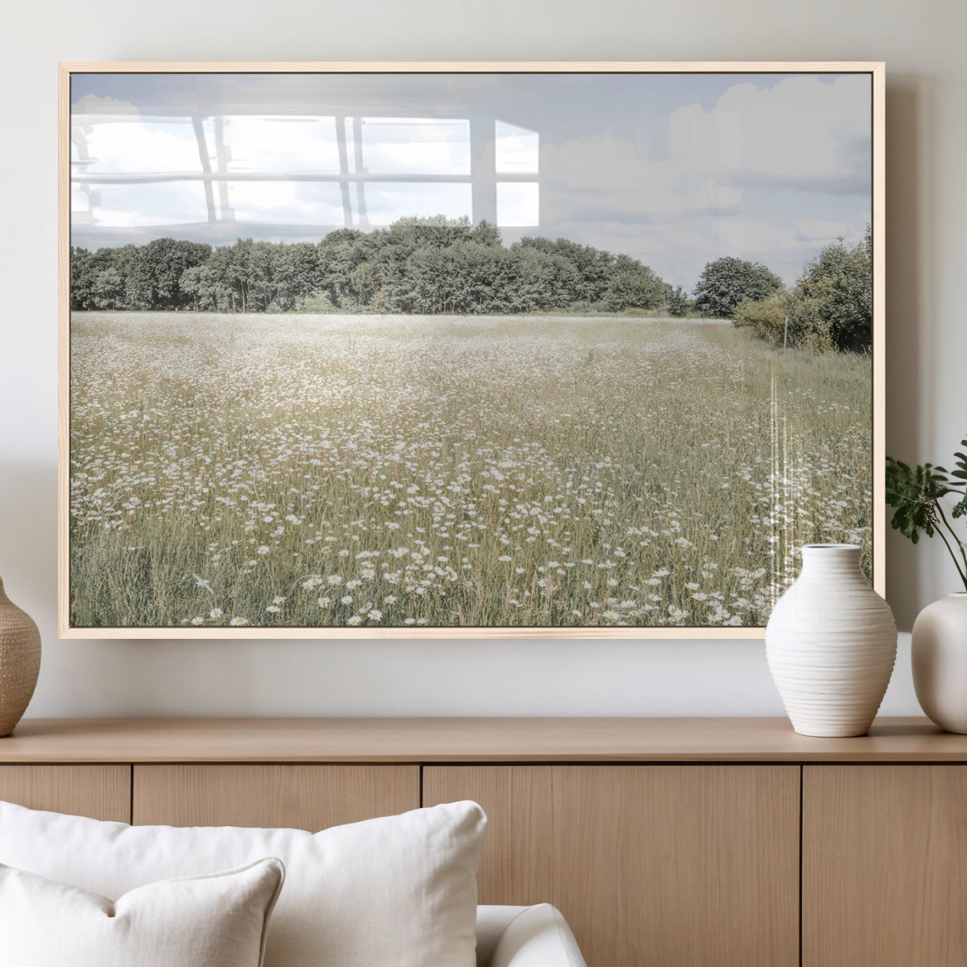 Soft-toned image of a wild daisy field under a cloudy sky, ideal for neutral or Scandinavian-inspired home decor.