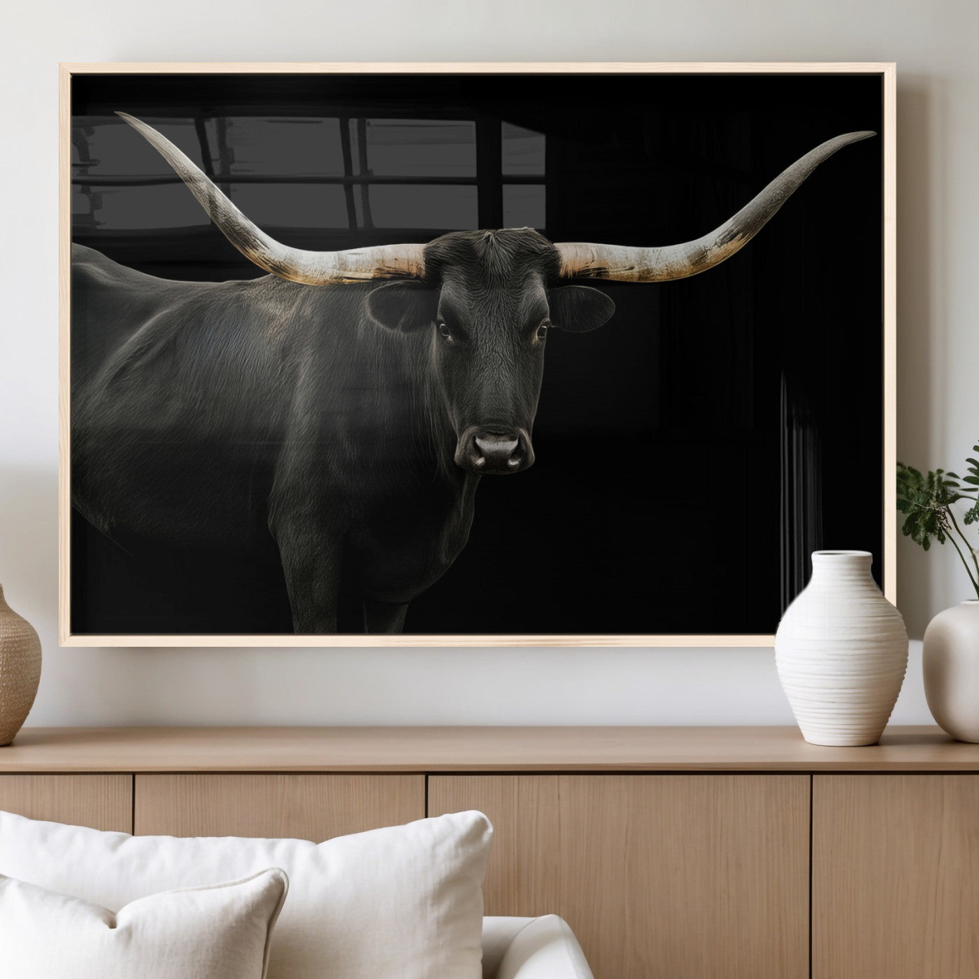 Close-up of a black Texas longhorn with large curved horns on black background, ideal for rustic farmhouse or modern western interiors.