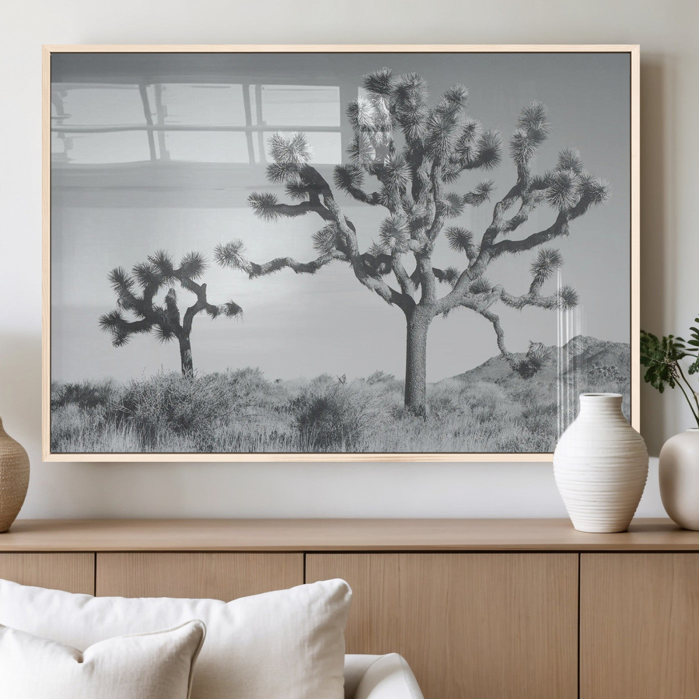 Black and white Joshua tree in a desert landscape with soft light and dry brush, perfect for rustic or minimalist home decor.