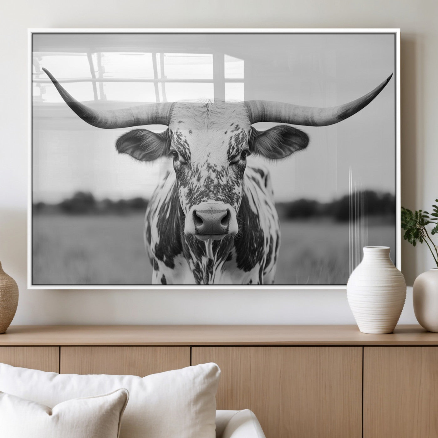Capture the strength and elegance of nature with this striking black and white portrait of a longhorn cow. Its powerful presence makes a bold statement in any room.