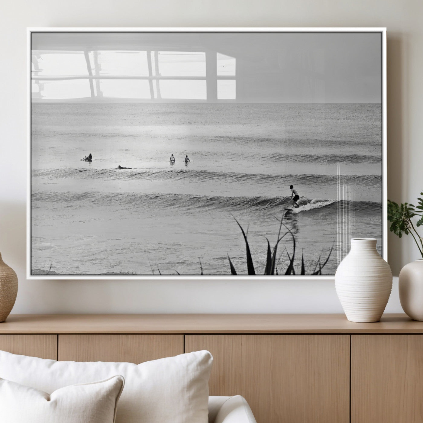 Monochrome canvas of surfers on calm ocean waves, ideal for minimalist coastal or beach-inspired interior decor.