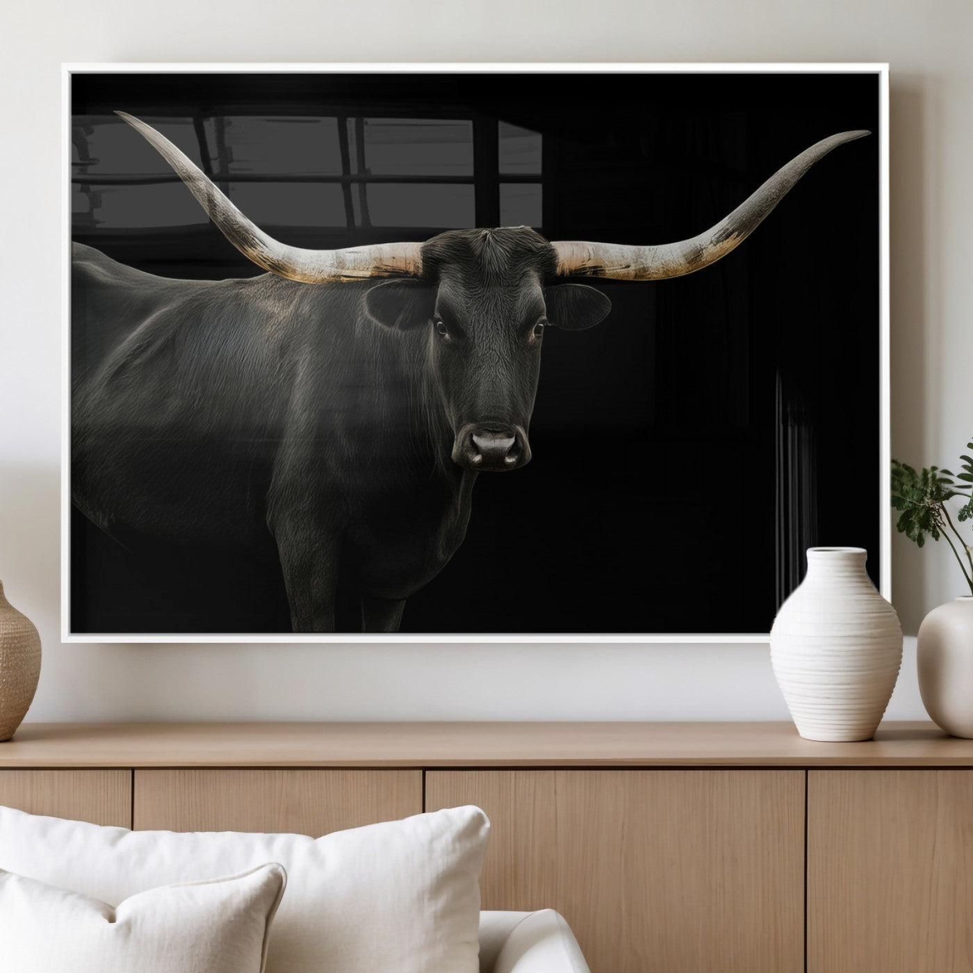 Close-up of a black Texas longhorn with large curved horns on black background, ideal for rustic farmhouse or modern western interiors.