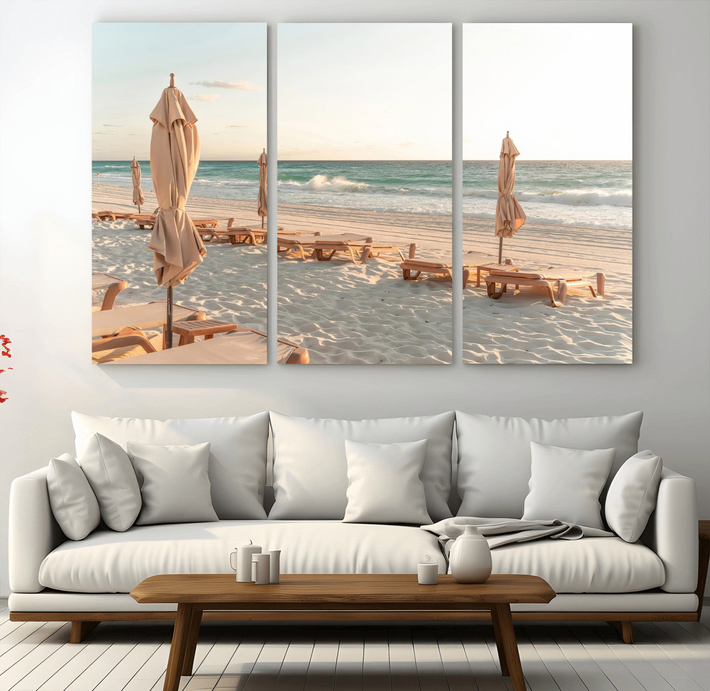 Minimalist photo of empty beach loungers and umbrellas on soft sand, ideal for calm seaside or pastel coastal-style home decor.