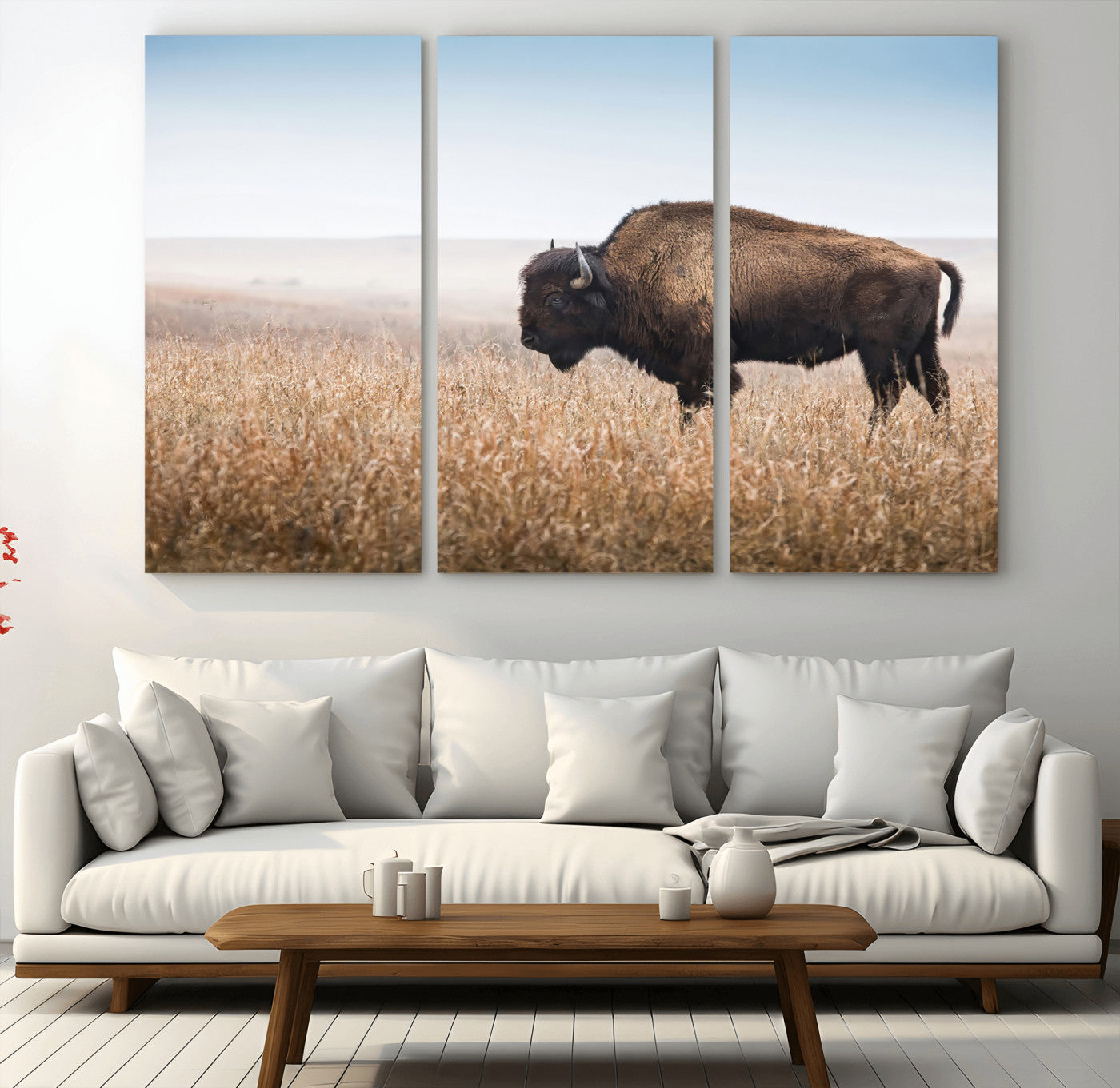 A majestic bison standing in an open prairie field, its strong form blending into the golden grass under a vast blue sky, evoking the wild spirit of the American plains.