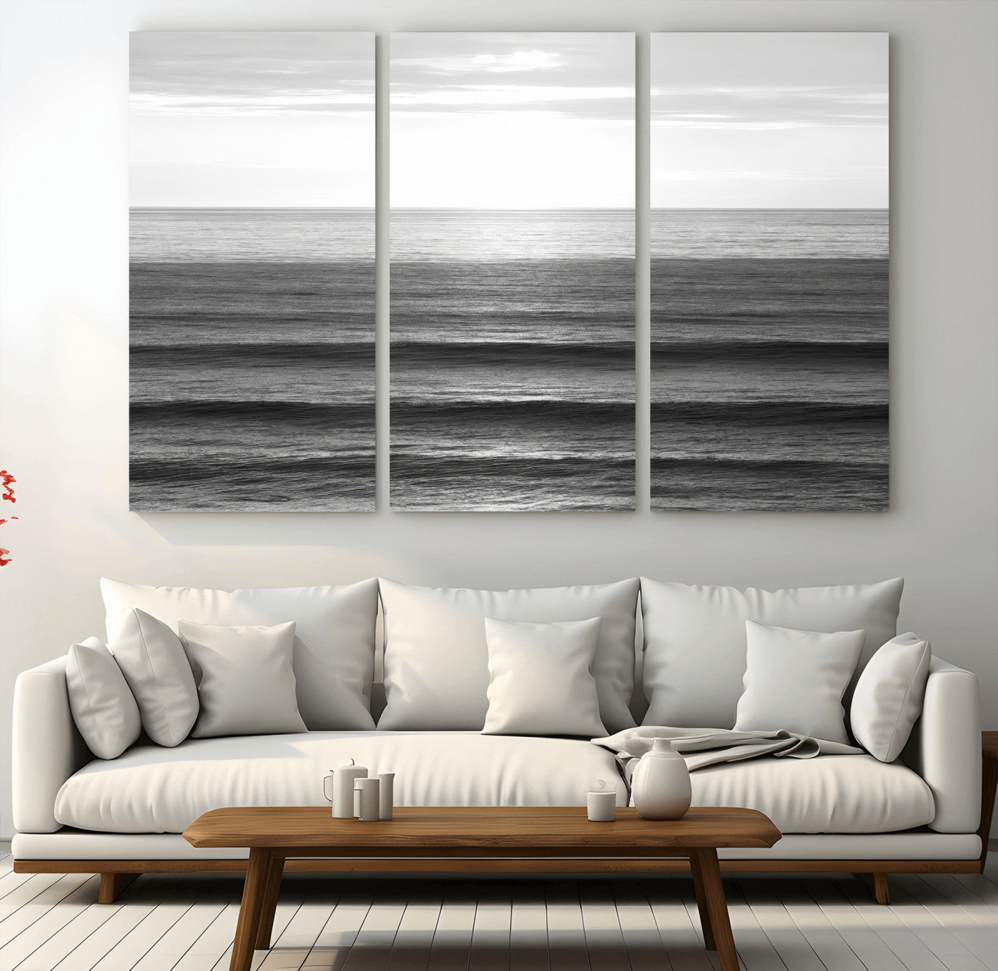 Minimalist black and white ocean view with layered waves reflecting sunlight, evoking a sense of calm and coastal serenity.