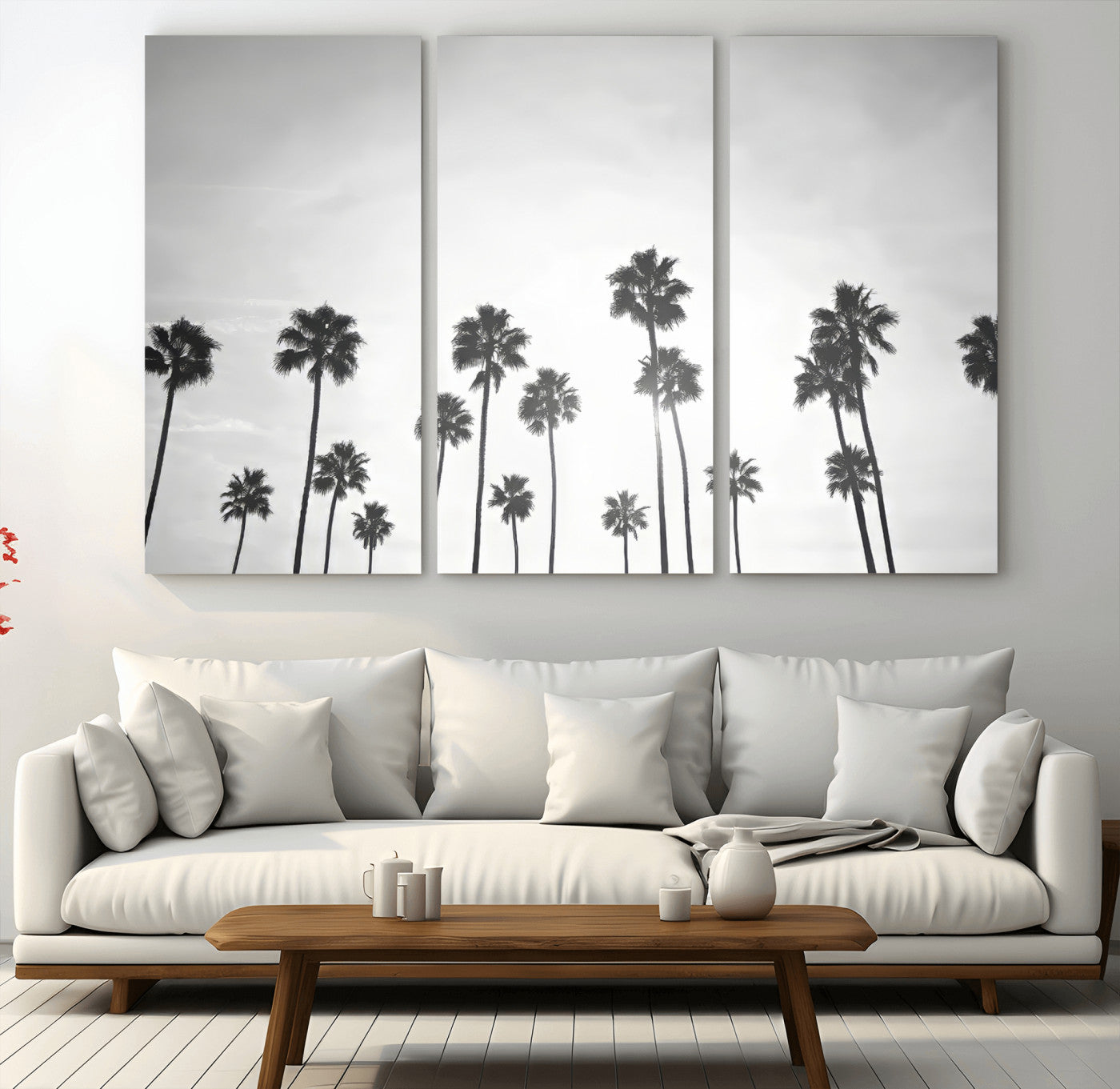 A black and white minimalist scene featuring tall palm trees silhouetted against a bright sky, creating a dreamy and timeless tropical aesthetic.