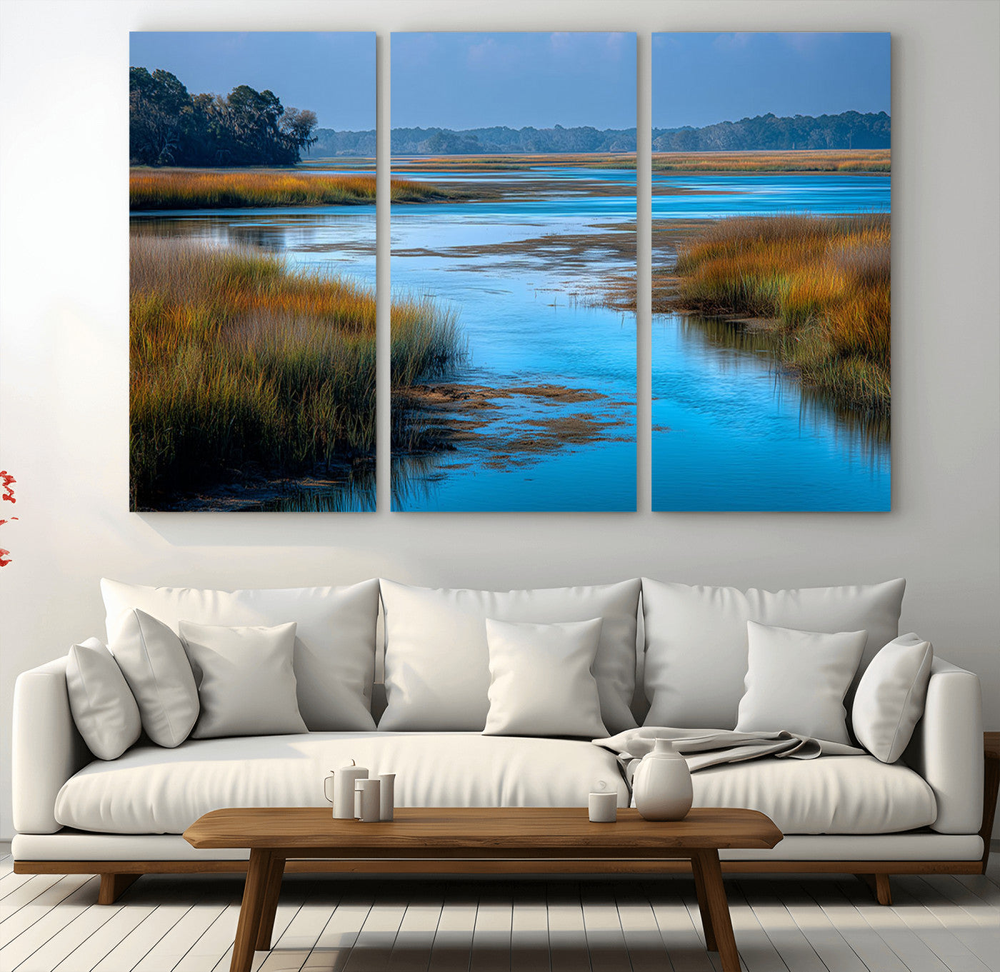 A peaceful marshland scene with calm blue water reflecting the surrounding grasses and trees, capturing the beauty of nature in a serene landscape.