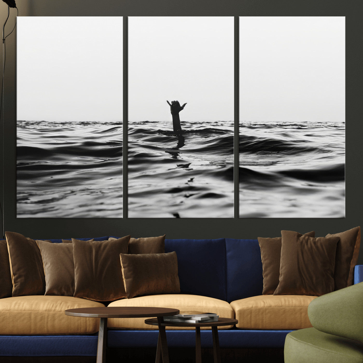 Black and white ocean with a hand making a surfer sign among dark waves, creating a dramatic and minimalist seascape with bold contrast.