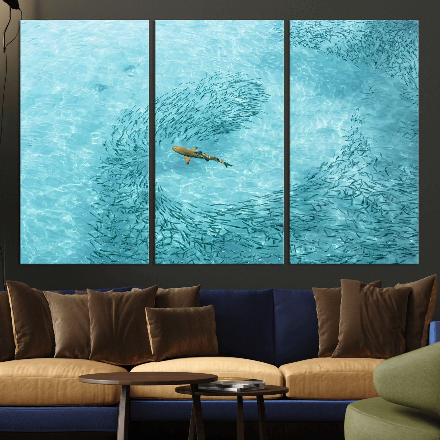 Aerial view of a shark swimming through a swirl of fish in clear turquoise waters, perfect for calm coastal or beach house decor.