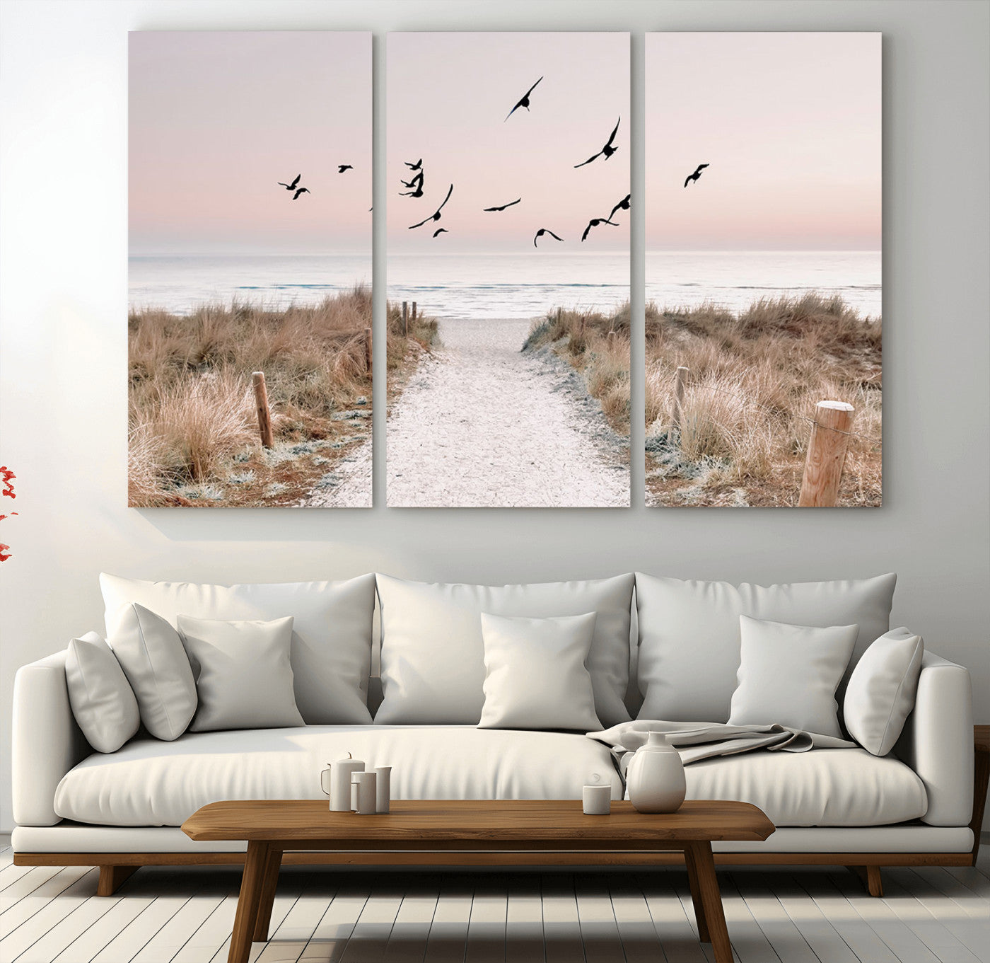 A peaceful coastal pathway leading to the ocean, with birds flying across a soft pastel sky, creating a calm and scenic beach atmosphere.