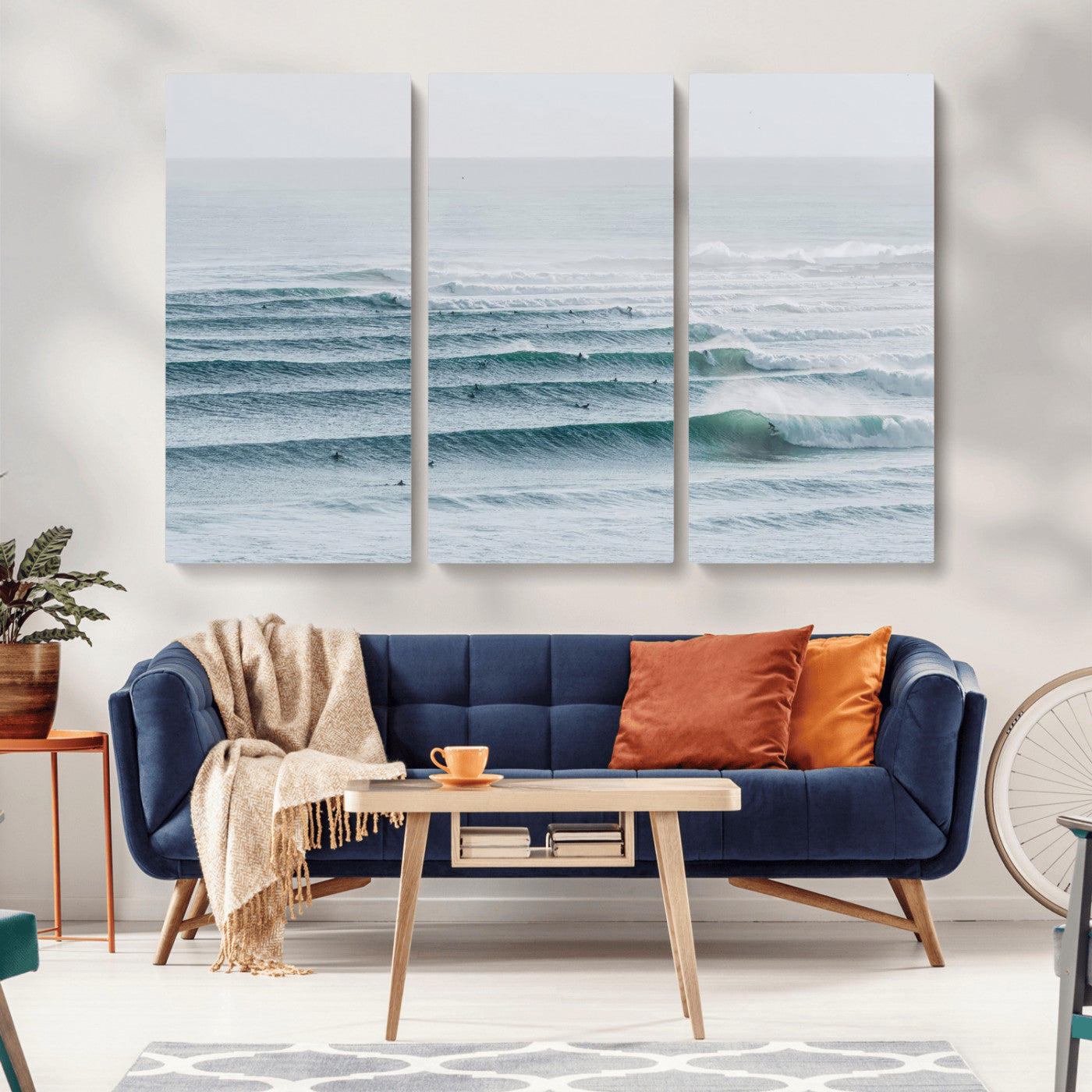 High-angle view of surfers lining up across layered ocean waves, ideal for minimal coastal or surf-inspired room decor.