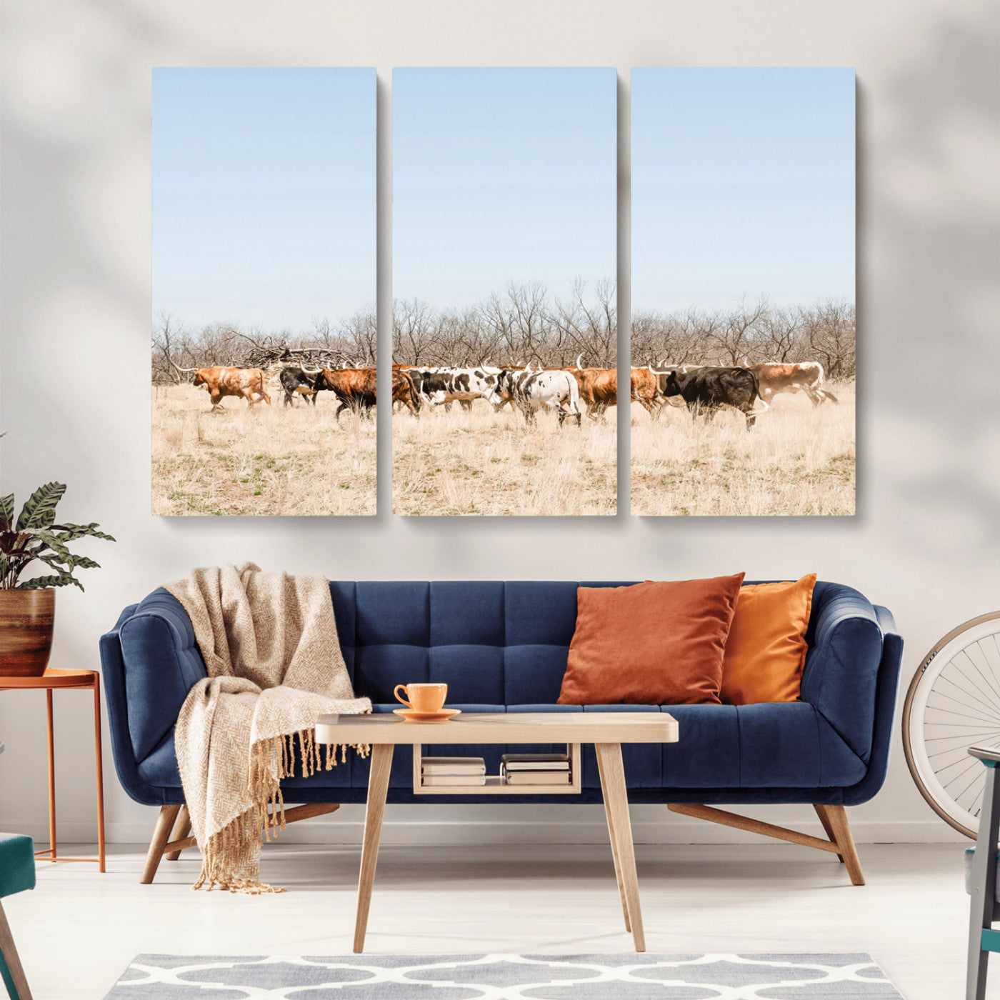 Framed wall art of Texas longhorn cattle walking through a dry, neutral-toned prairie, perfect for rustic farmhouse or western-themed home decor.