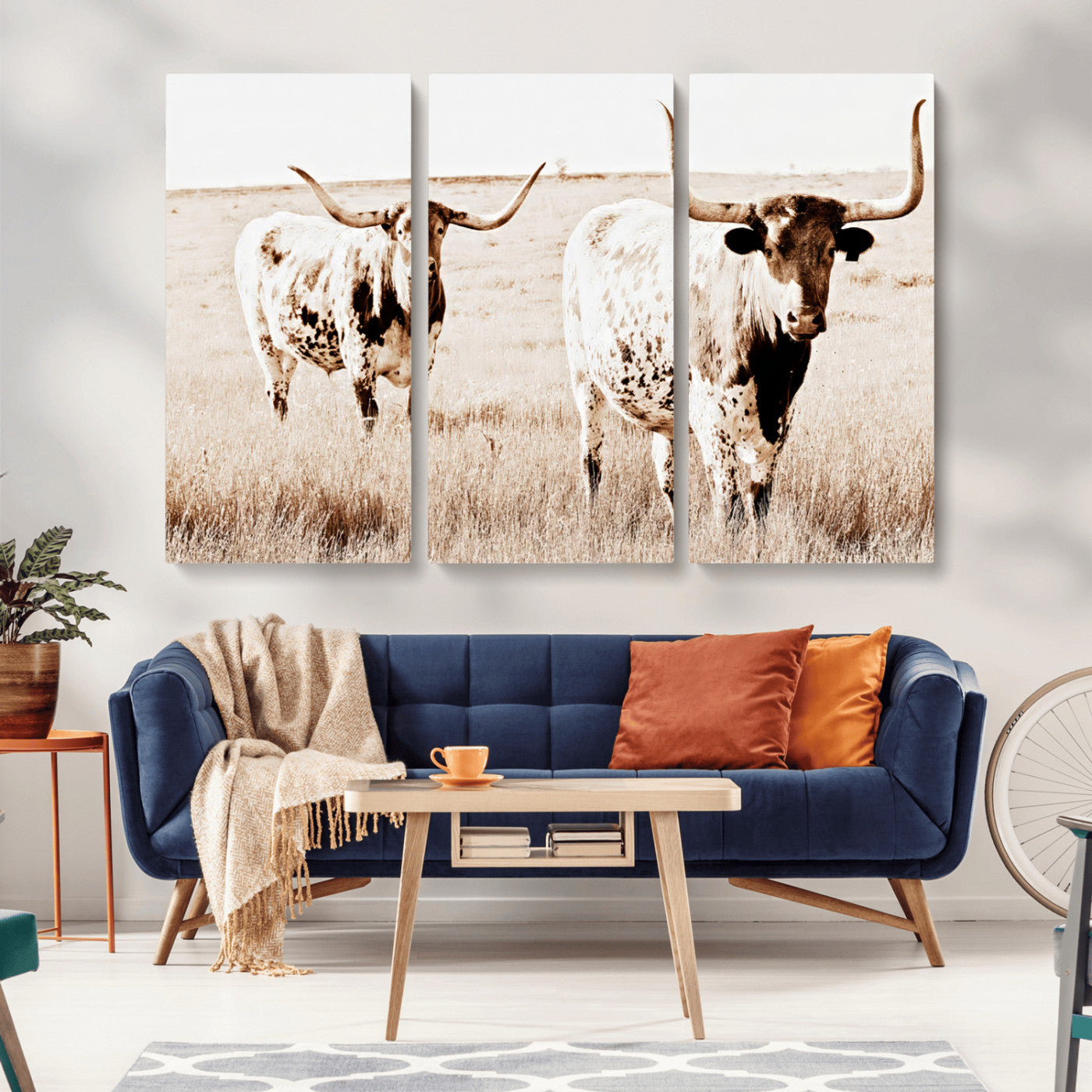 Two Texas longhorn cows standing in a sepia-toned pasture, evoking rustic charm perfect for farmhouse or western country interiors. (