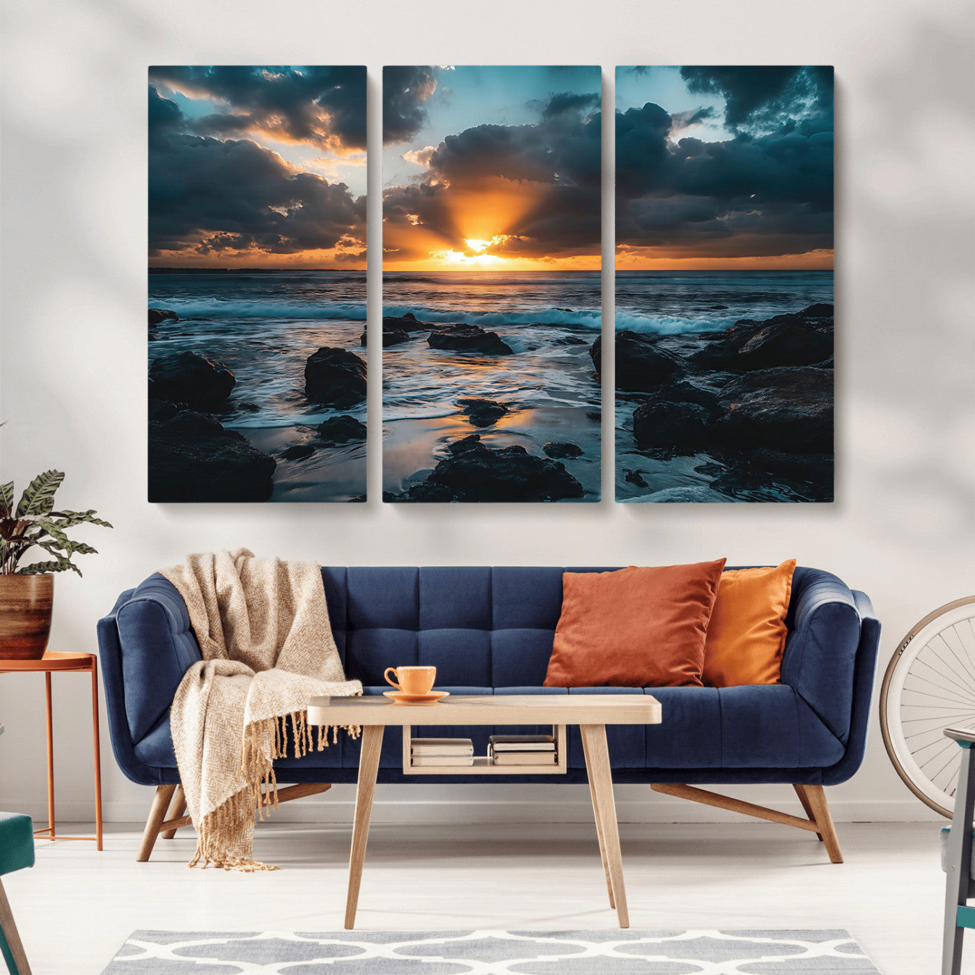 An awe-inspiring sunset over the ocean with rays of light piercing through dramatic clouds, creating a beautiful seascape with rocks in the foreground.