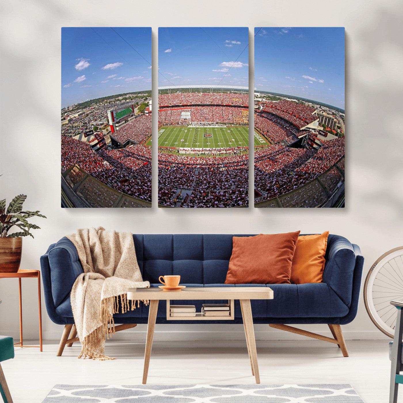 An William Brice-Stadium view of a full football stadium with cheering fans and clear blue skies, capturing the excitement and energy of the game.