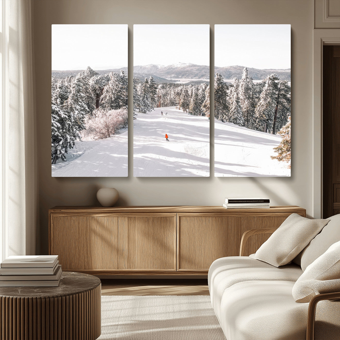 Bright ski trail lined with snow-covered pines and a skier in orange, perfect for alpine adventure or winter sports-inspired decor.