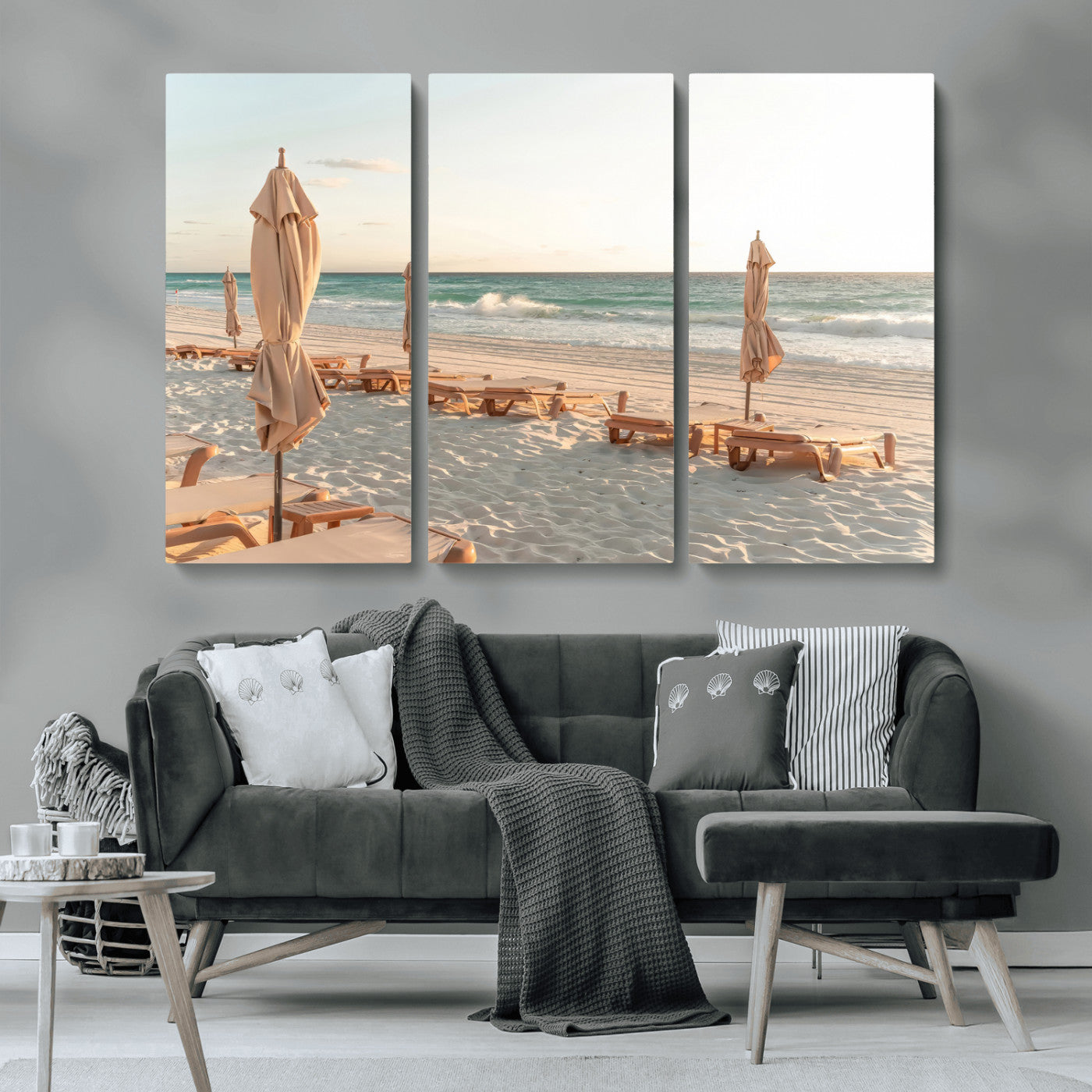 Minimalist photo of empty beach loungers and umbrellas on soft sand, ideal for calm seaside or pastel coastal-style home decor.