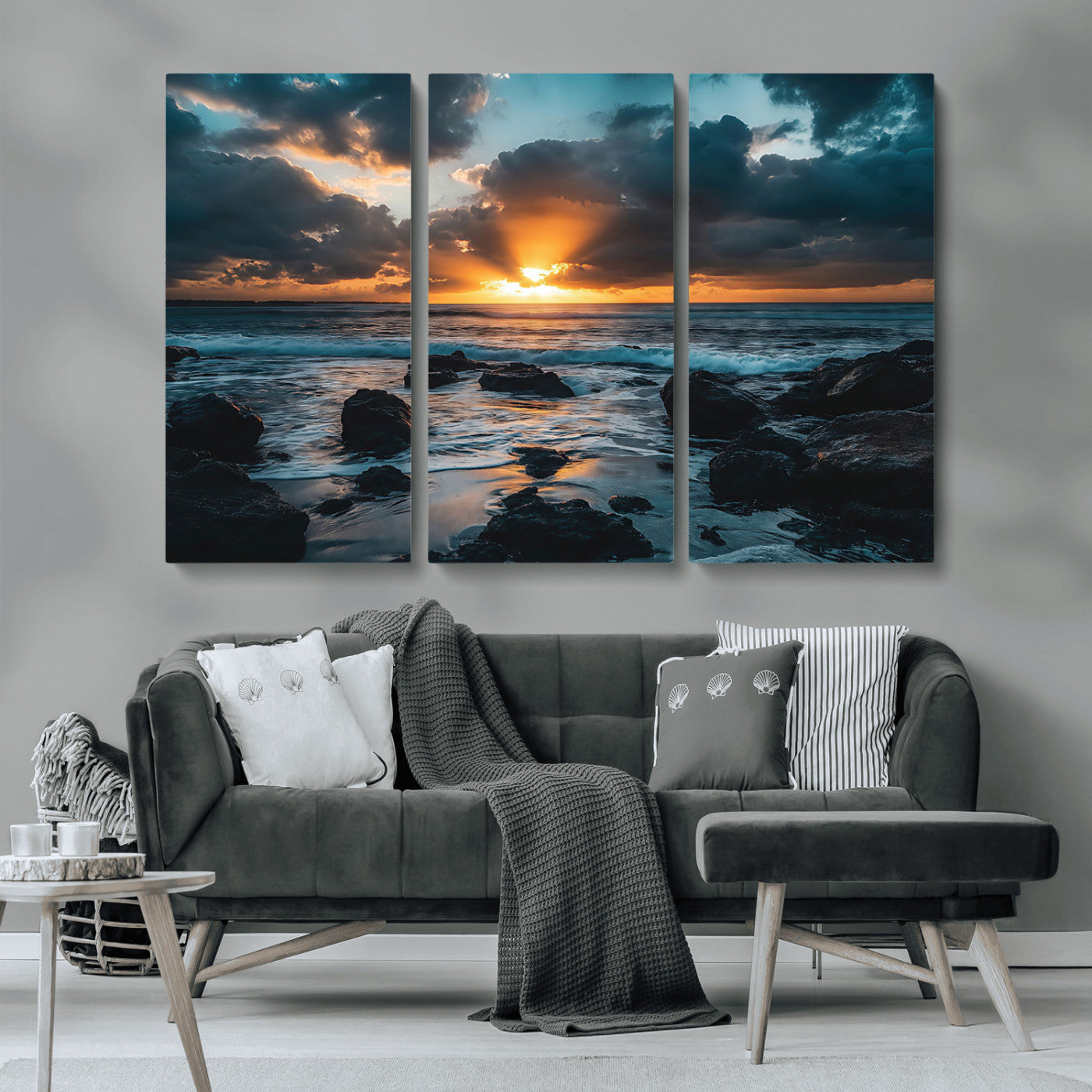 An awe-inspiring sunset over the ocean with rays of light piercing through dramatic clouds, creating a beautiful seascape with rocks in the foreground.