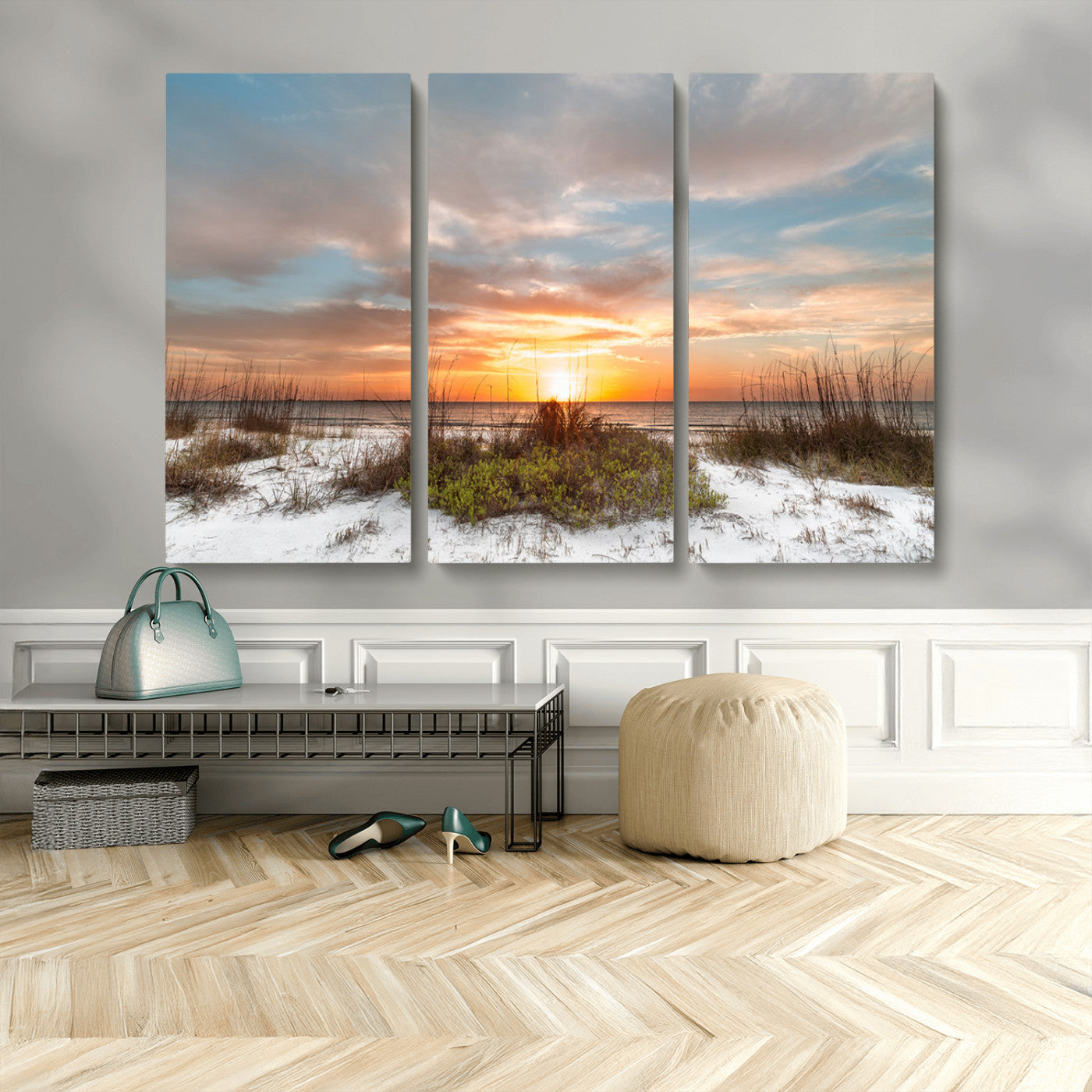 A tranquil beach scene featuring golden sunset hues over the water, with grasses in the foreground and a peaceful, serene atmosphere.