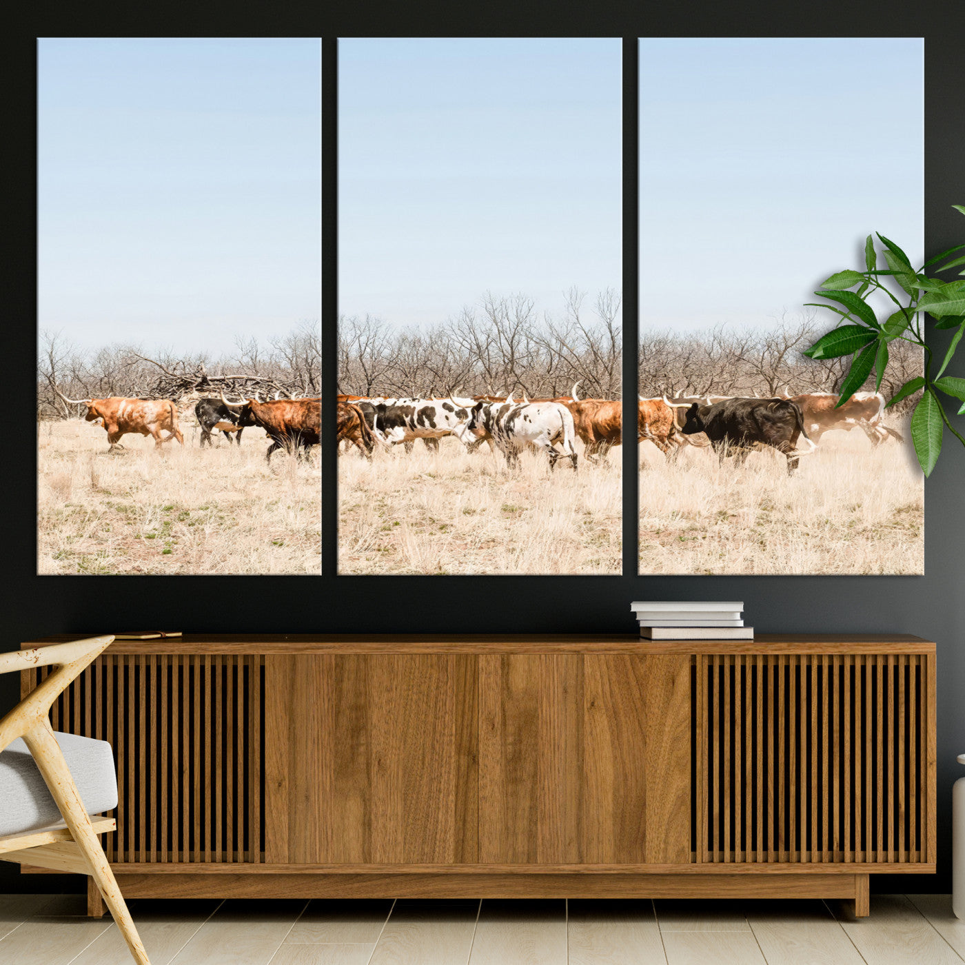 Framed wall art of Texas longhorn cattle walking through a dry, neutral-toned prairie, perfect for rustic farmhouse or western-themed home decor.