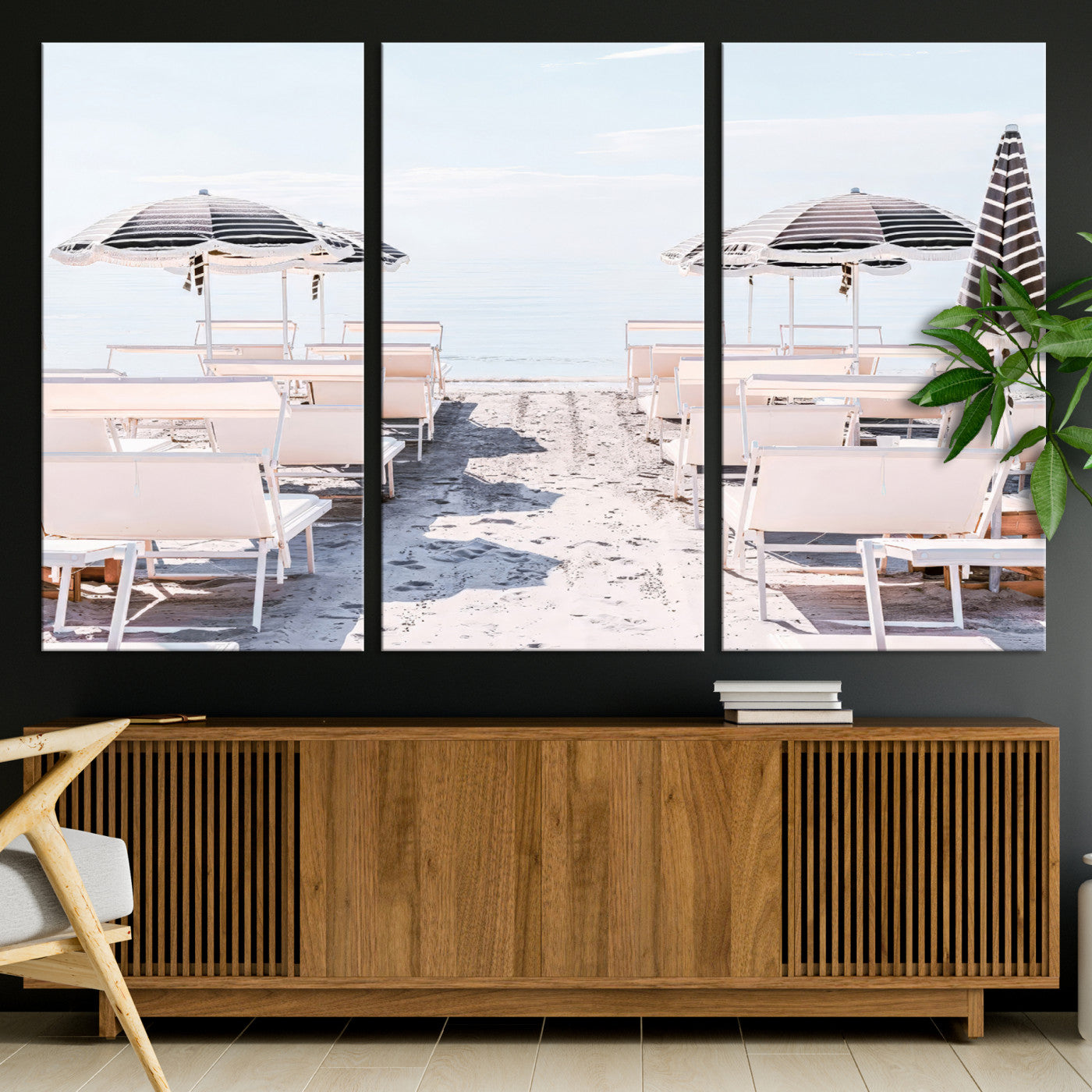 A serene minimalist beach scene featuring striped umbrellas, soft pastel sand, and an elegant lounge setup, creating a tranquil and stylish coastal retreat.