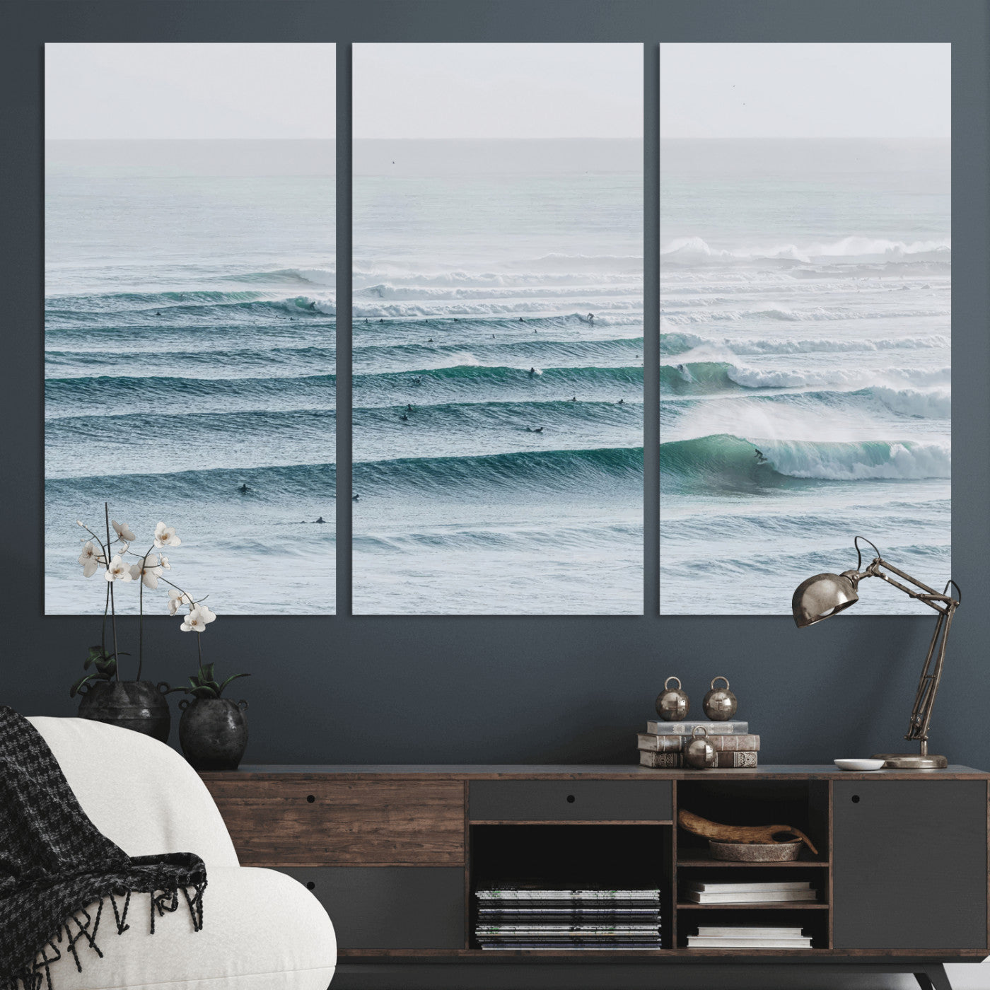 High-angle view of surfers lining up across layered ocean waves, ideal for minimal coastal or surf-inspired room decor.