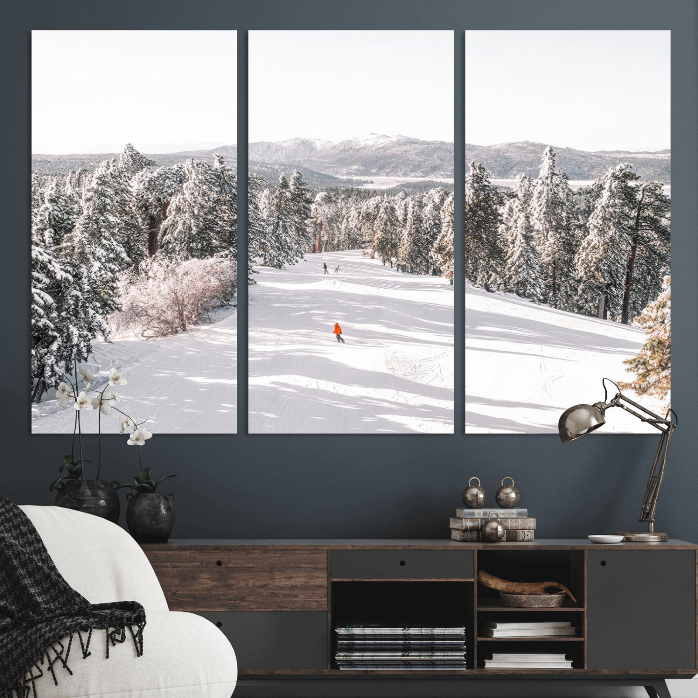 Bright ski trail lined with snow-covered pines and a skier in orange, perfect for alpine adventure or winter sports-inspired decor.