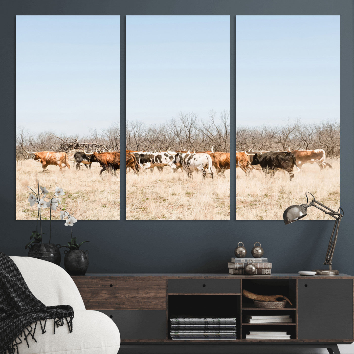 Framed wall art of Texas longhorn cattle walking through a dry, neutral-toned prairie, perfect for rustic farmhouse or western-themed home decor.