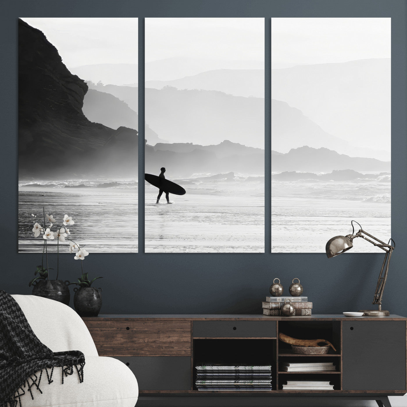 A lone surfer walking along a misty beach with cliffs in the background, carrying their board, capturing a serene and minimal ocean moment.