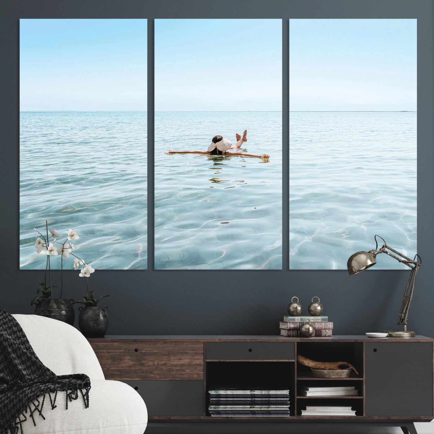 A peaceful minimalist scene of a person floating on crystal-clear water, surrounded by a vast open horizon, capturing relaxation and serenity in a tranquil aquatic setting.