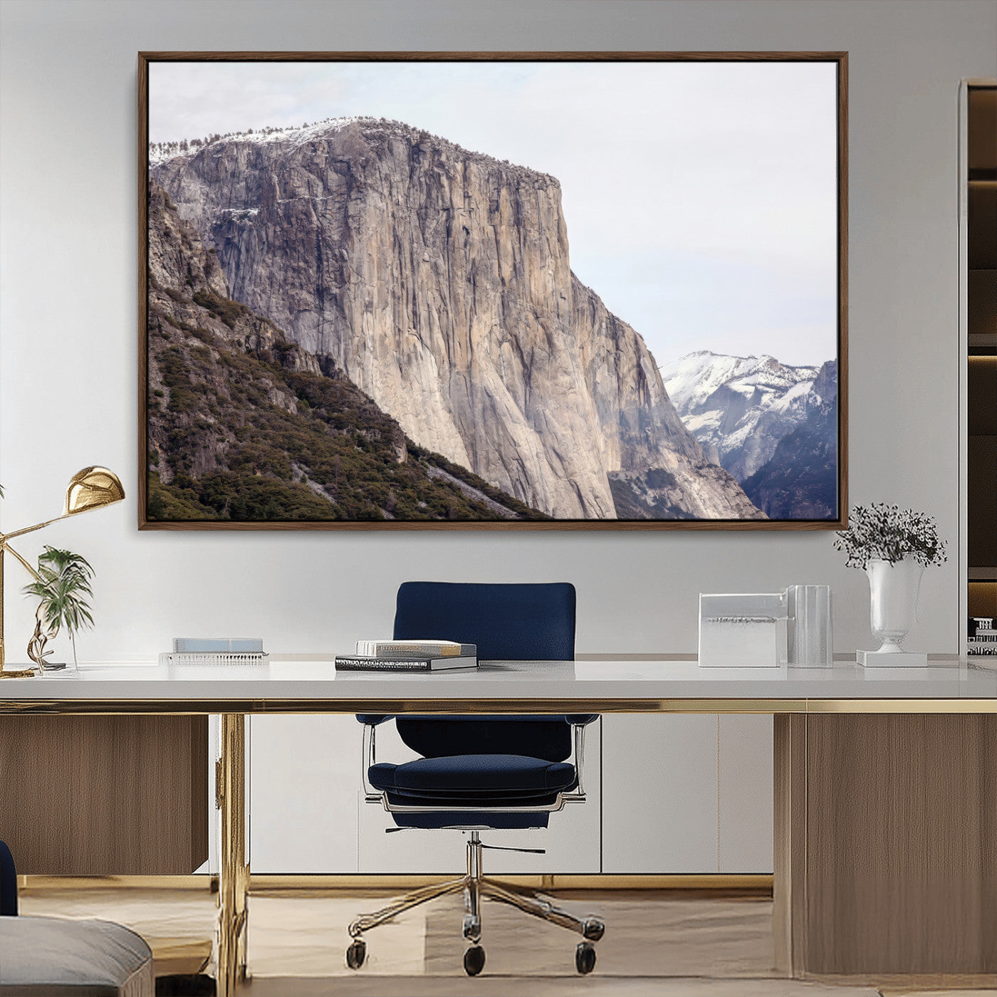 Framed canvas of El Capitan’s vertical granite face in Yosemite with snowy peaks, ideal for Sierra minimalism or mountain-inspired decor.