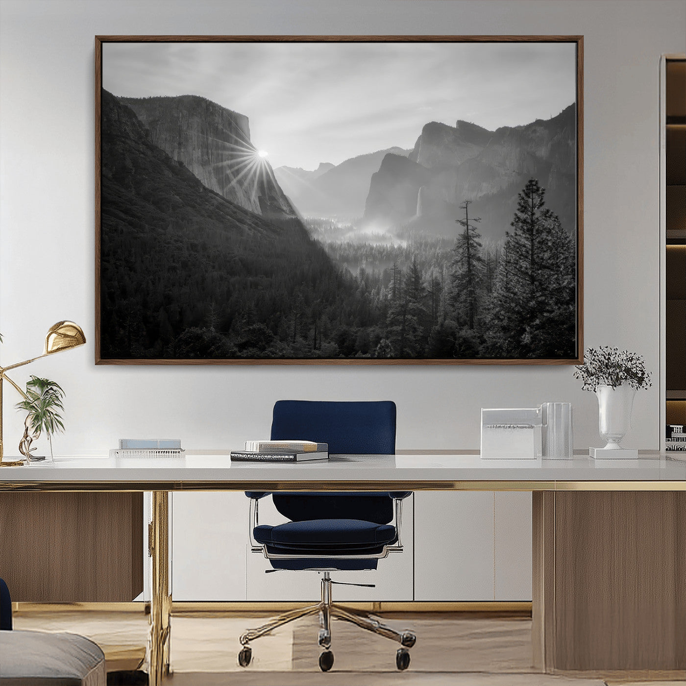 Black and white landscape of Yosemite with sun rays peeking over El Capitan, ideal for moody nature or modern rustic decor.