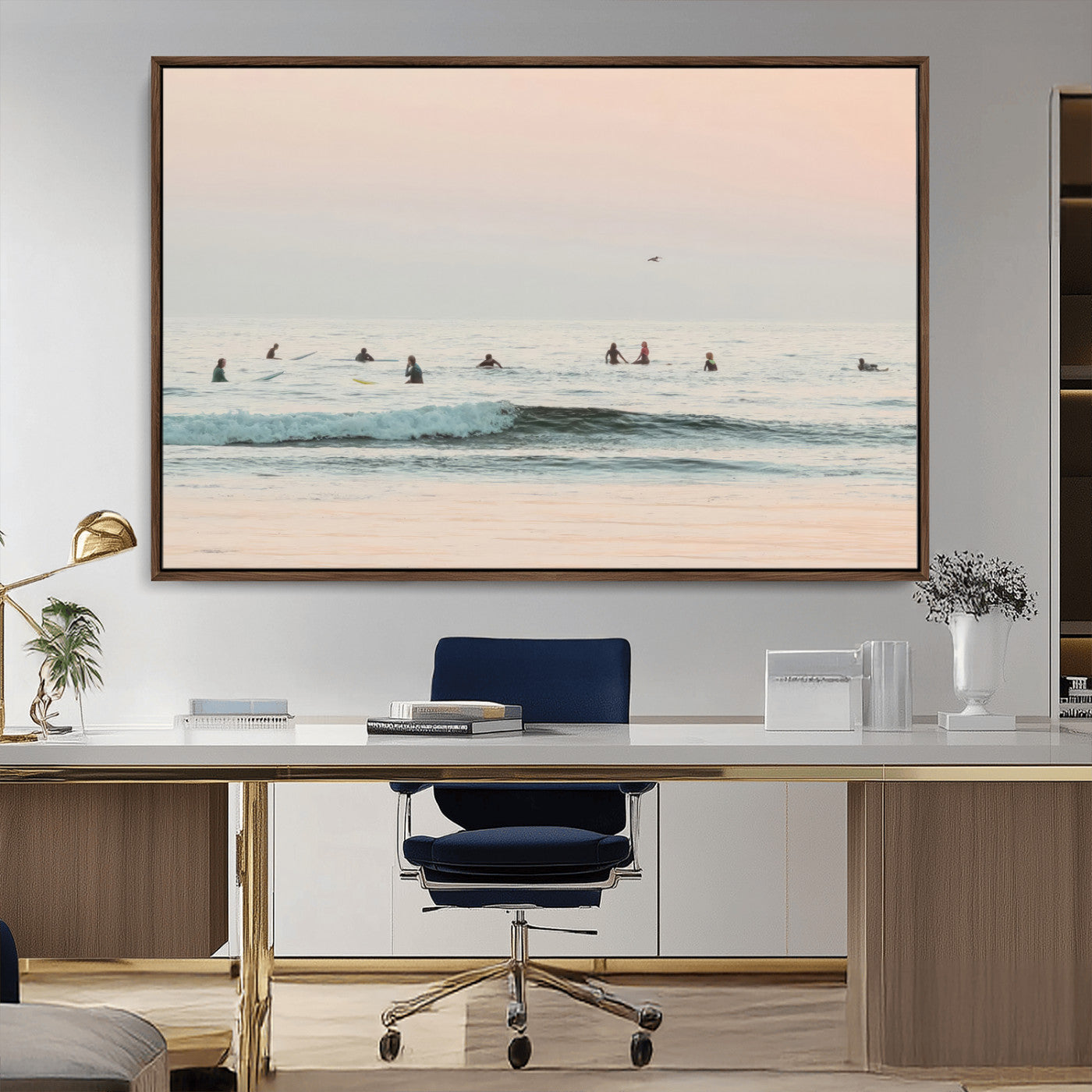Dreamy photo of surfers waiting on soft pastel waves under a pink sunset sky, ideal for soft coastal minimalist or serene ocean-themed home decor.