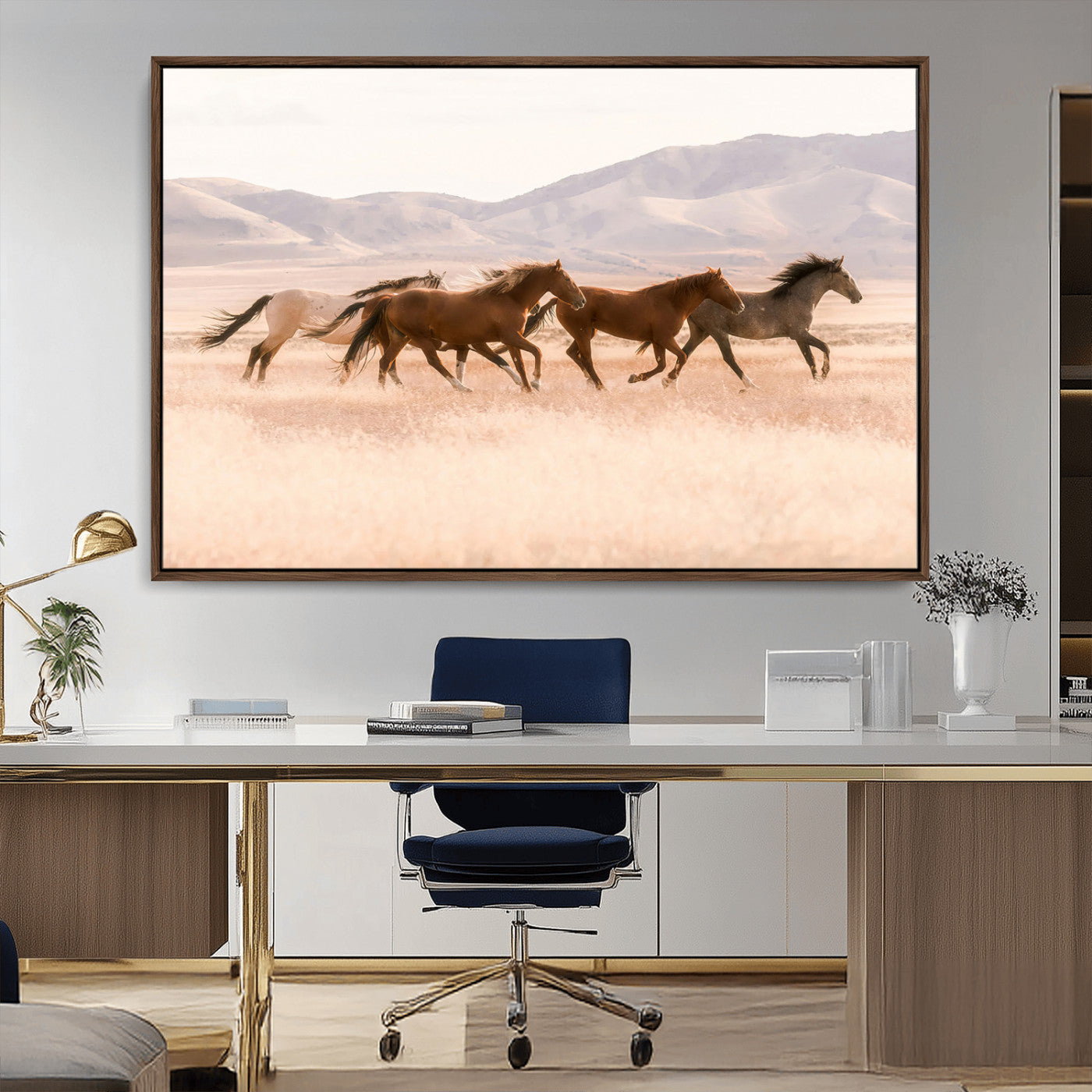 A herd of wild horses galloping through a sunlit desert plain with mountains in the background, perfect for rustic or western-themed wall decor.