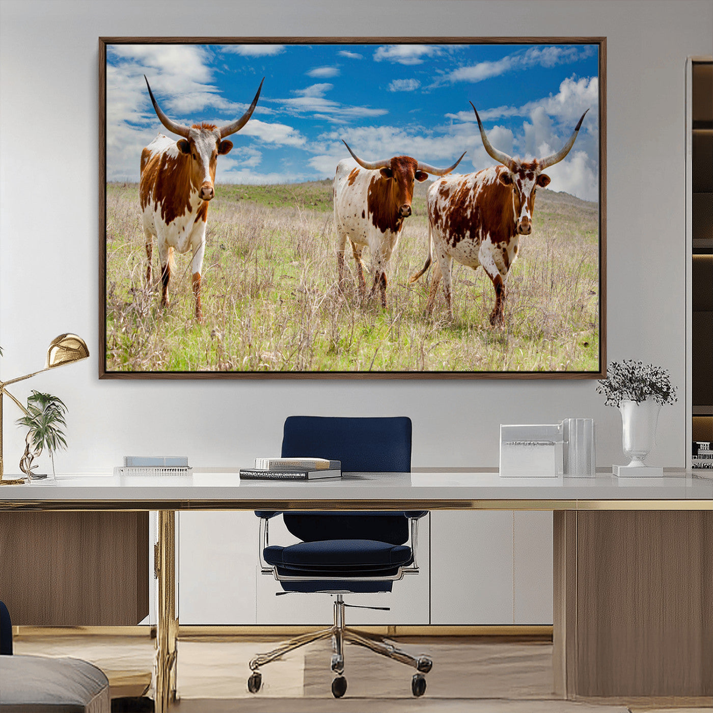 Three Texas longhorn cattle standing in dry grass under a bright blue sky, ideal for farmhouse or western rustic home decor.