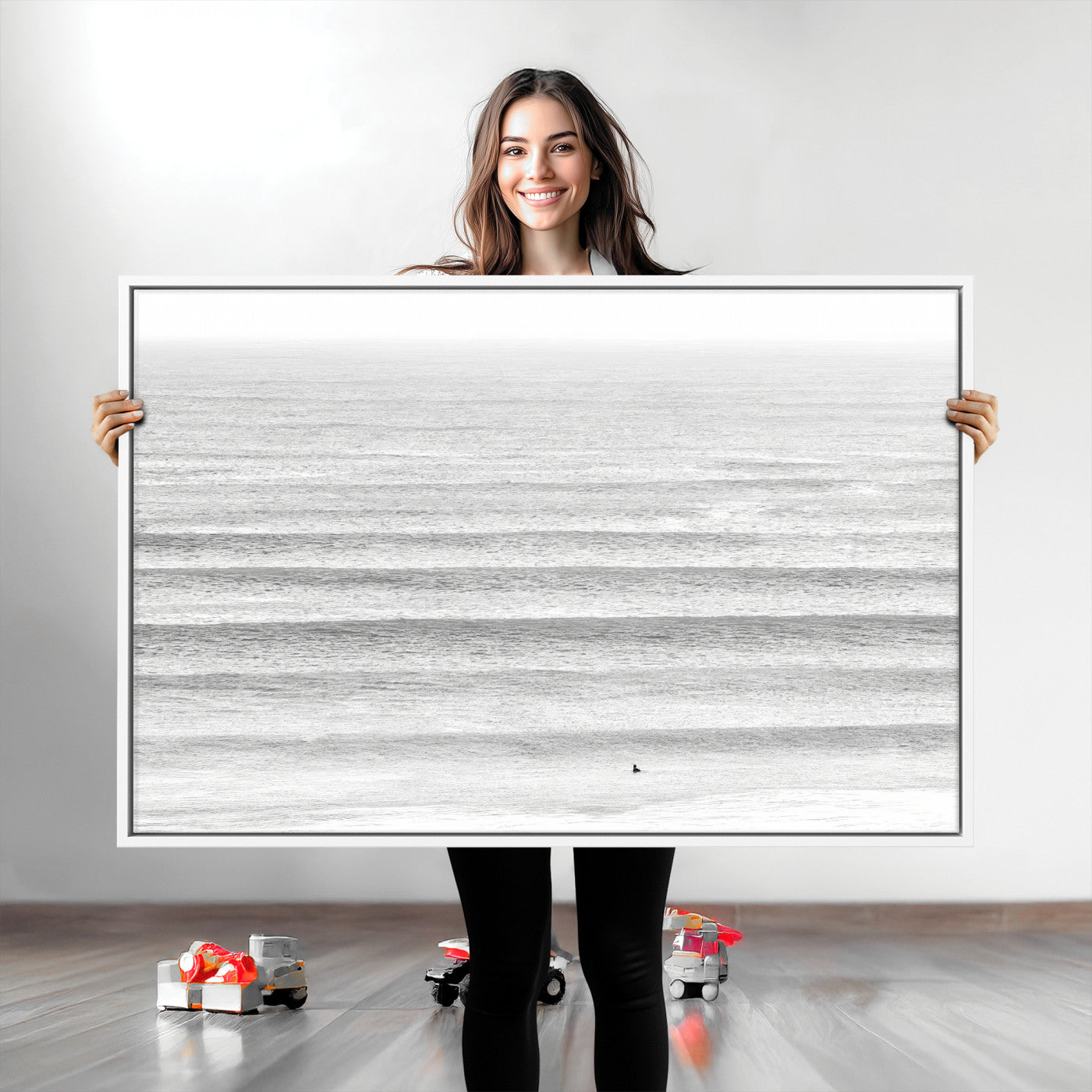 Monochrome photo of a lone surfer in calm layered waves, perfect for minimalist coastal or moody ocean-inspired wall decoration.