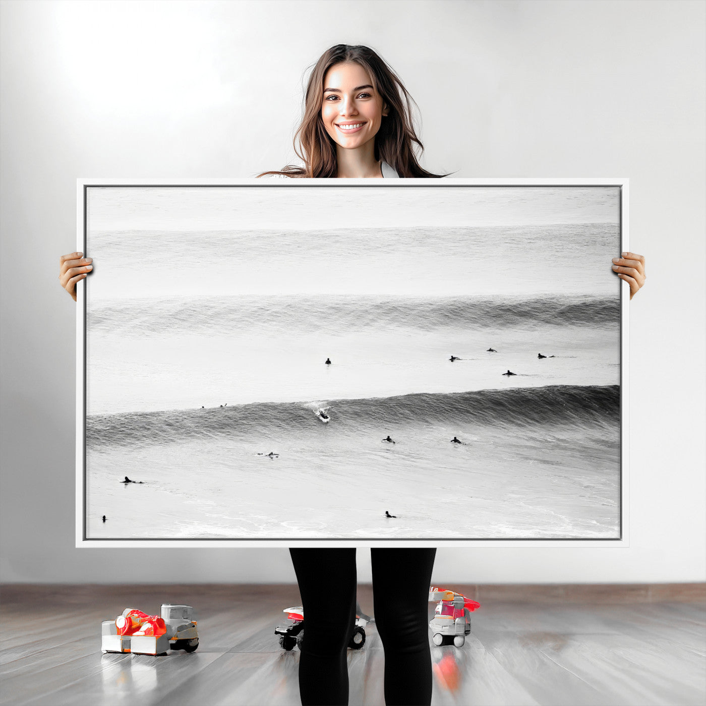A monochrome photograph of swimmers gliding through gentle ocean waves, evoking a sense of calm and movement.