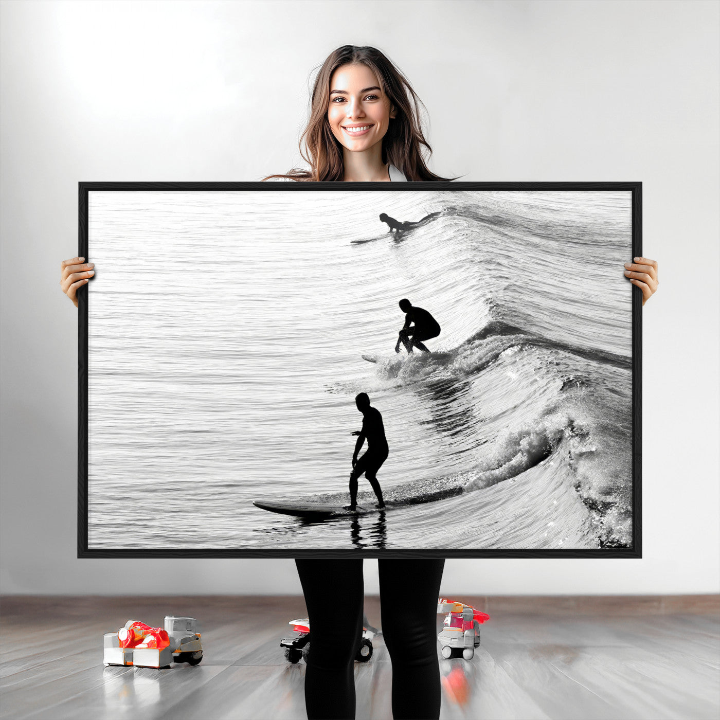Black and white photo of surfers riding waves in a moody, high-contrast scene, ideal for modern coastal or surf-inspired home decor.