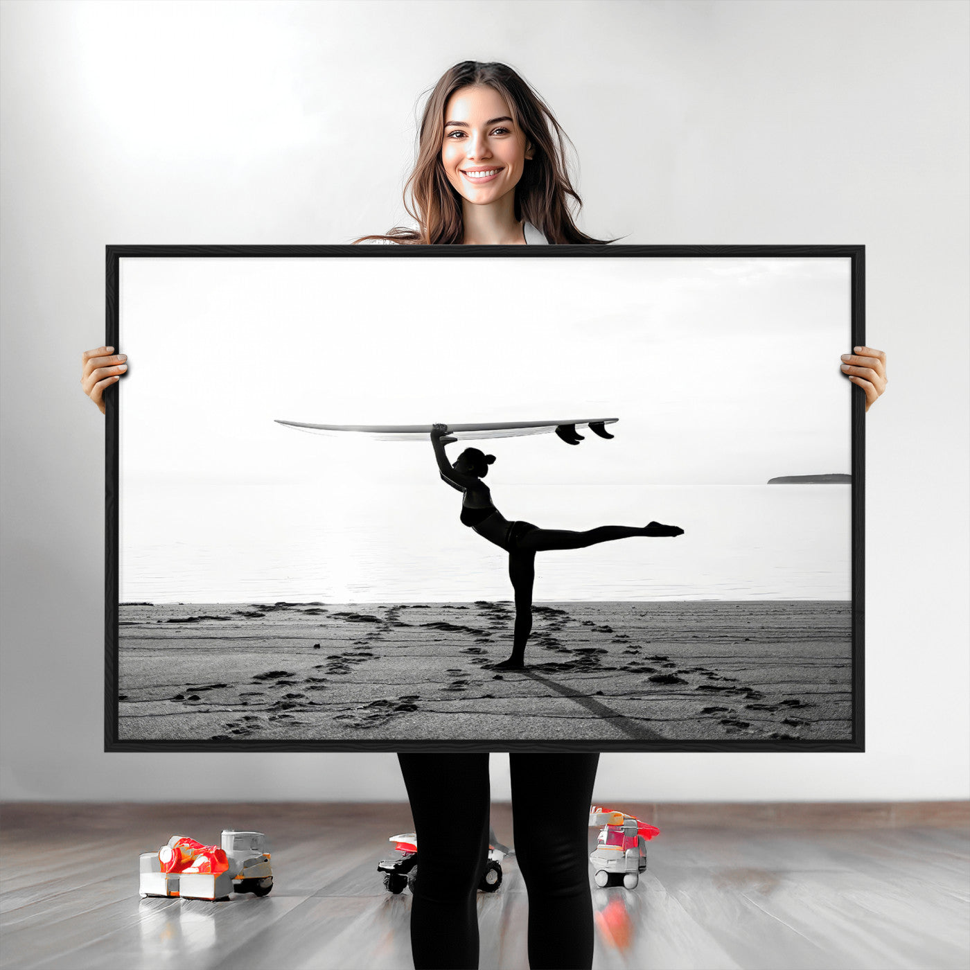 A woman balances a surfboard on her head while striking a yoga pose on the beach, silhouetted against a calm ocean horizon.